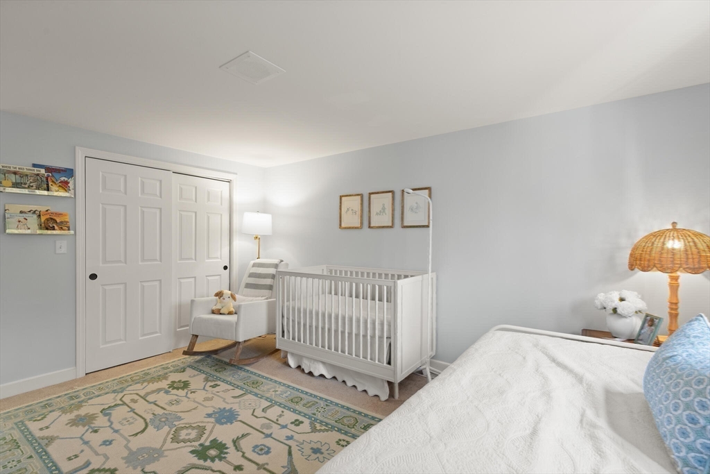 300 Willow Street, Unit 3 Hamilton, MA 01982 - Photo 25 of 39 a bedroom with a bed and a window
