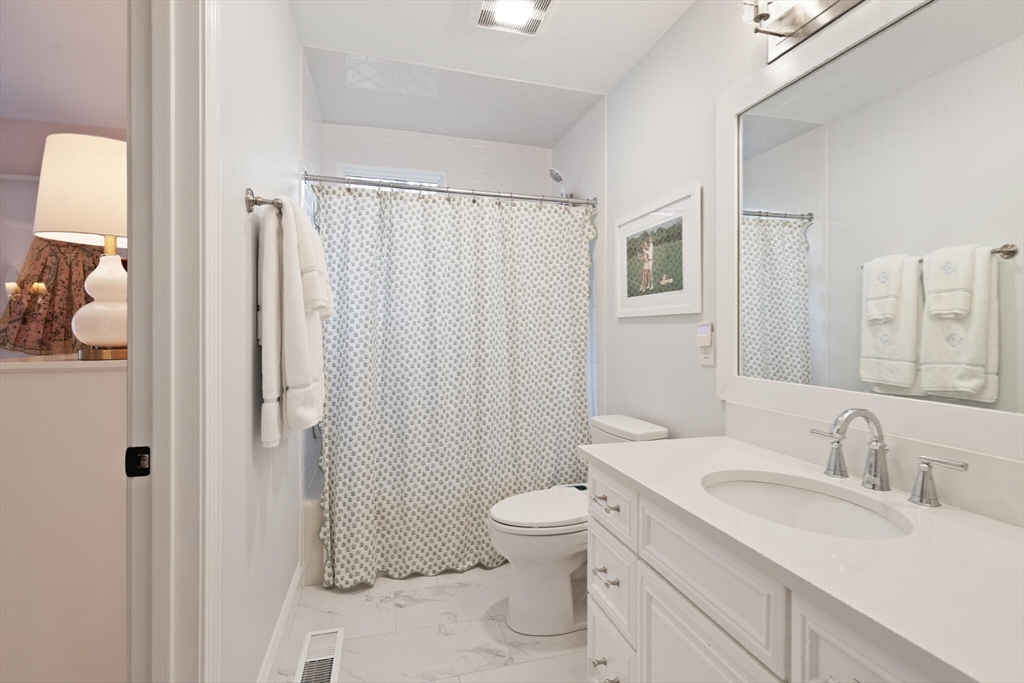 300 Willow Street, Unit 3 Hamilton, MA 01982 - Photo 26 of 39 a bathroom with a sink toilet double vanity and shower