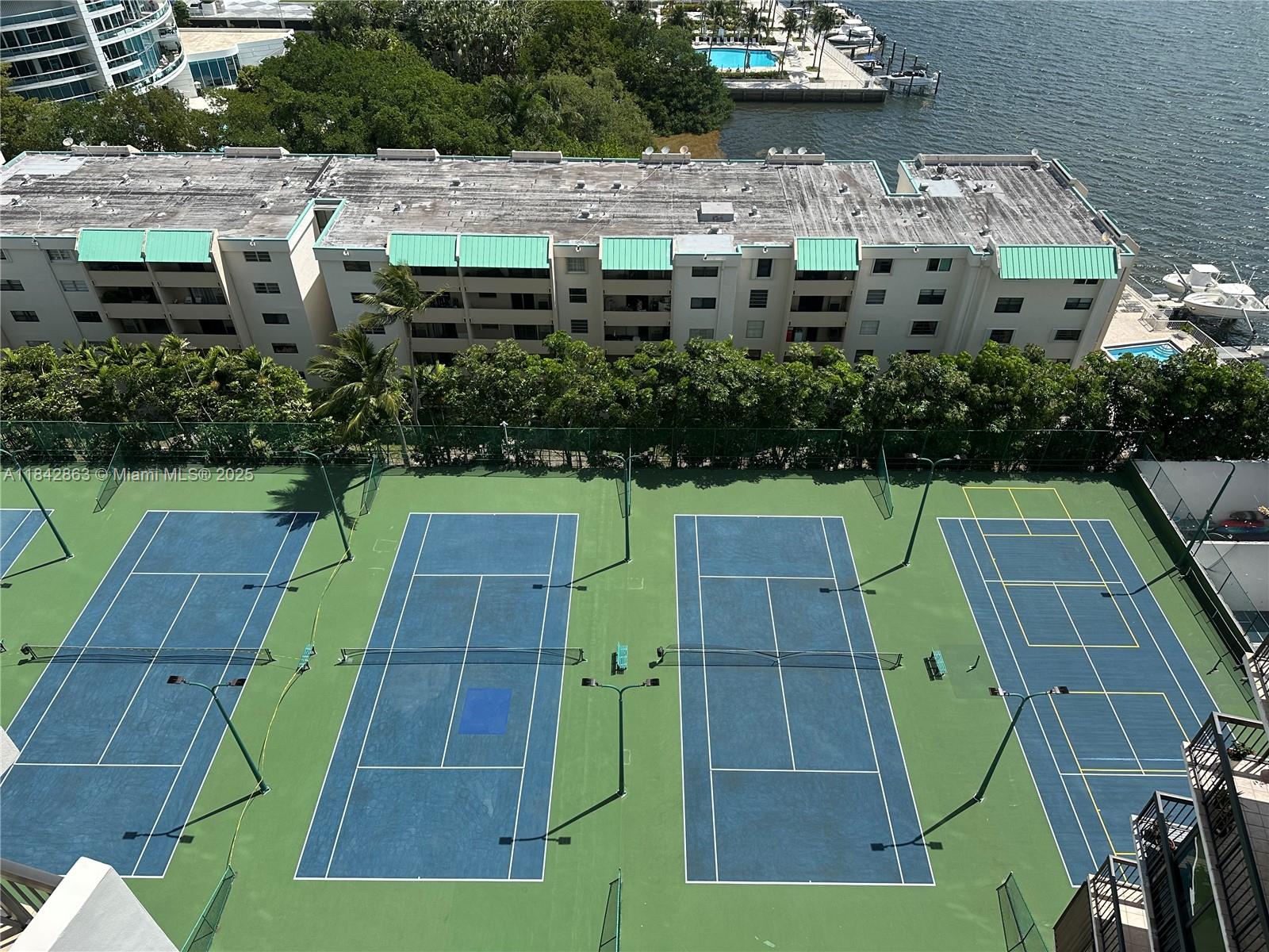 Brickell Miami, FL 33129 - Photo 2 of 8 an aerial view of a tennis ground and large trees