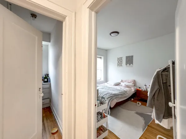 a bedroom with bed and a window