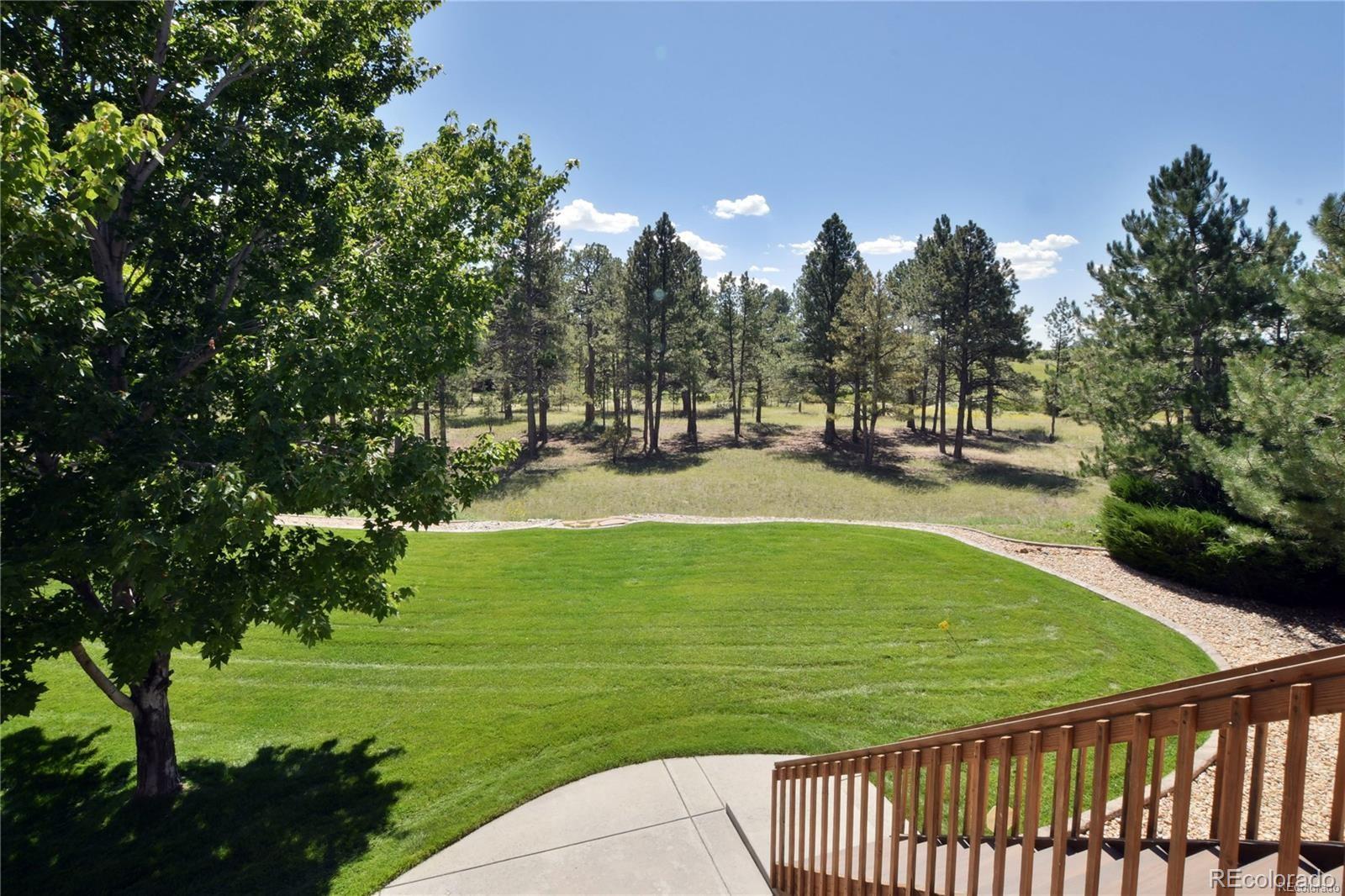 5283 Pinyon Jay Road Parker, CO 80134 - Photo 11 of 12 a view of a golf course with a garden