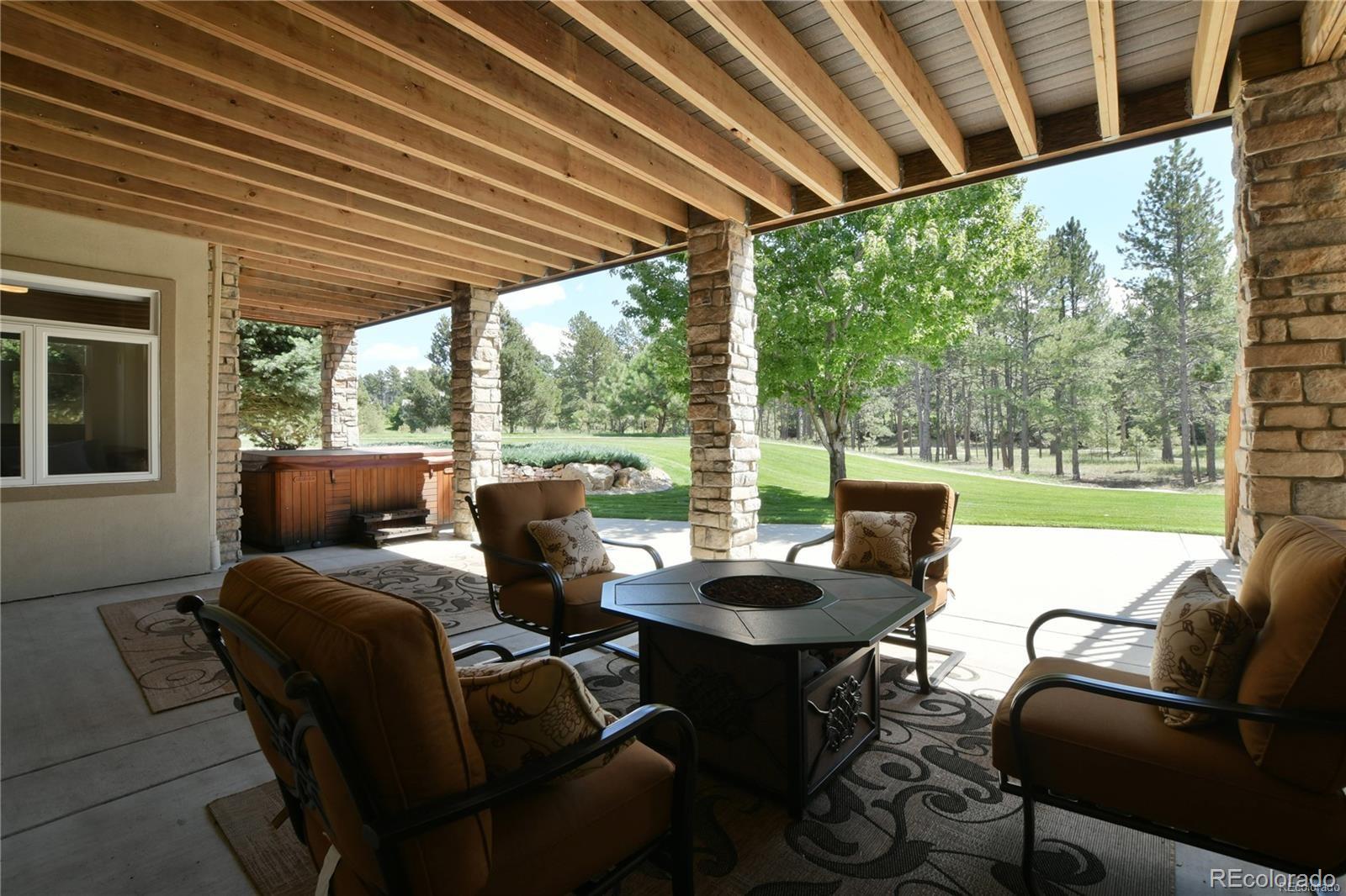 5283 Pinyon Jay Road Parker, CO 80134 - Photo 12 of 12 a outdoor living space with patio furniture and garden view