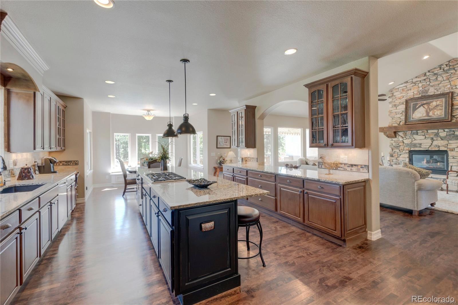 5283 Pinyon Jay Road Parker, CO 80134 - Photo 4 of 12 a kitchen with sink stove and cabinets
