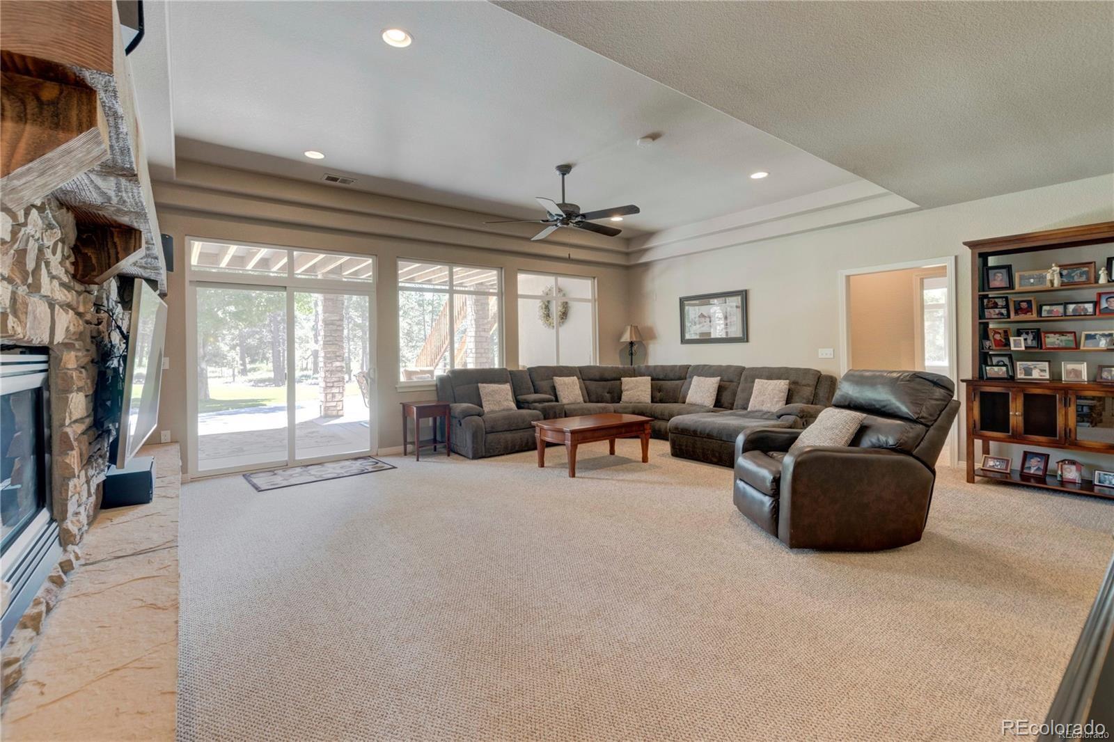 5283 Pinyon Jay Road Parker, CO 80134 - Photo 9 of 12 a living room with furniture and a large window