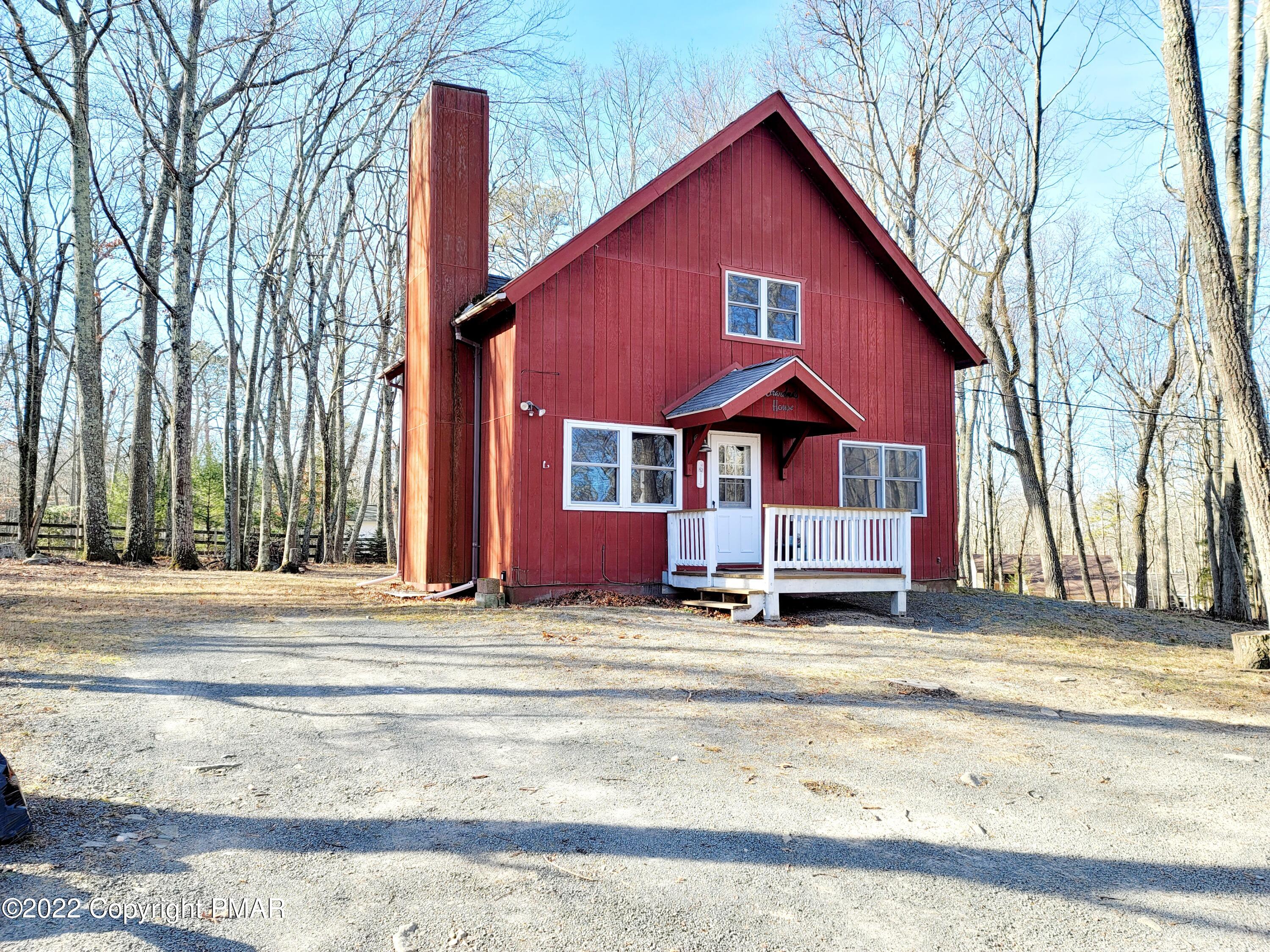 132 Rodeo Drive Hawley, PA 18428 - Photo 1 of 26 a view of a house with a patio and a yard