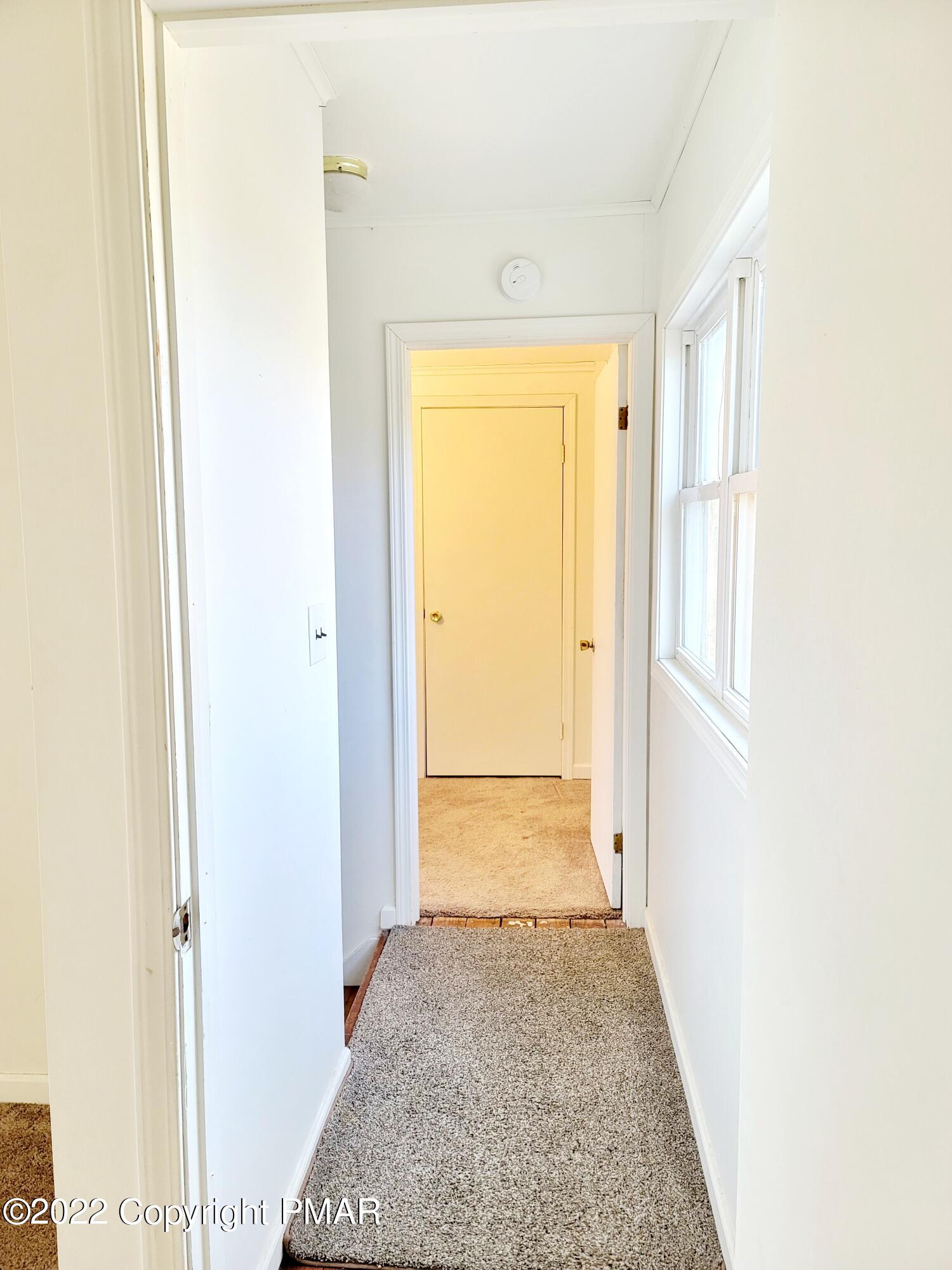 132 Rodeo Drive Hawley, PA 18428 - Photo 14 of 26 a view of hallway with wooden floor