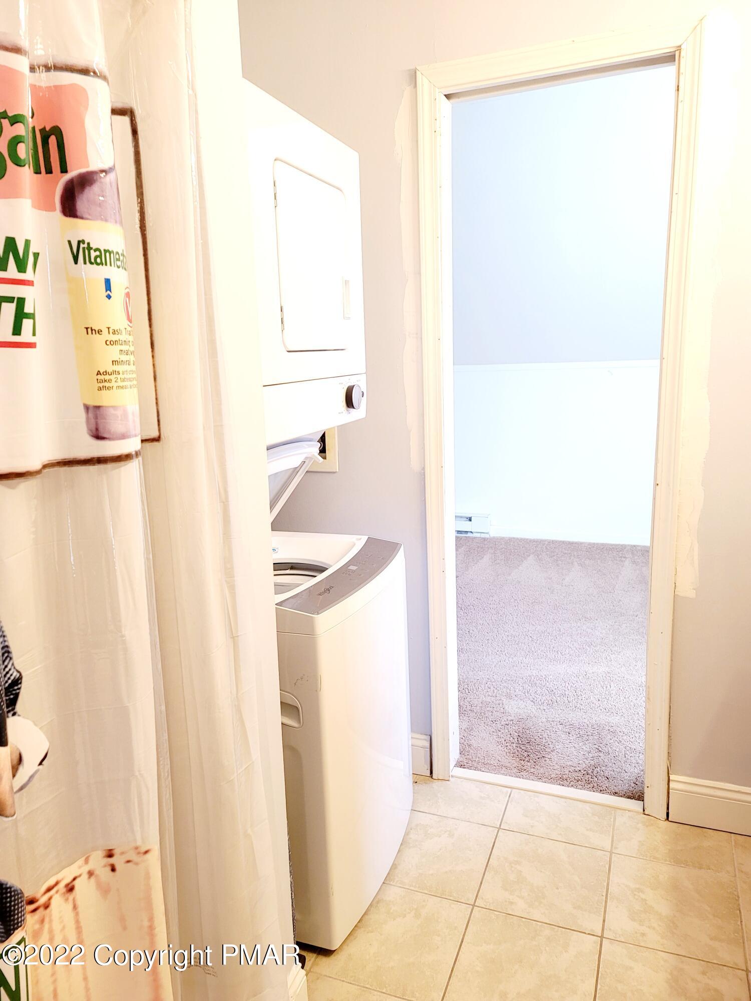 132 Rodeo Drive Hawley, PA 18428 - Photo 20 of 26 a bathroom with a sink and a mirror