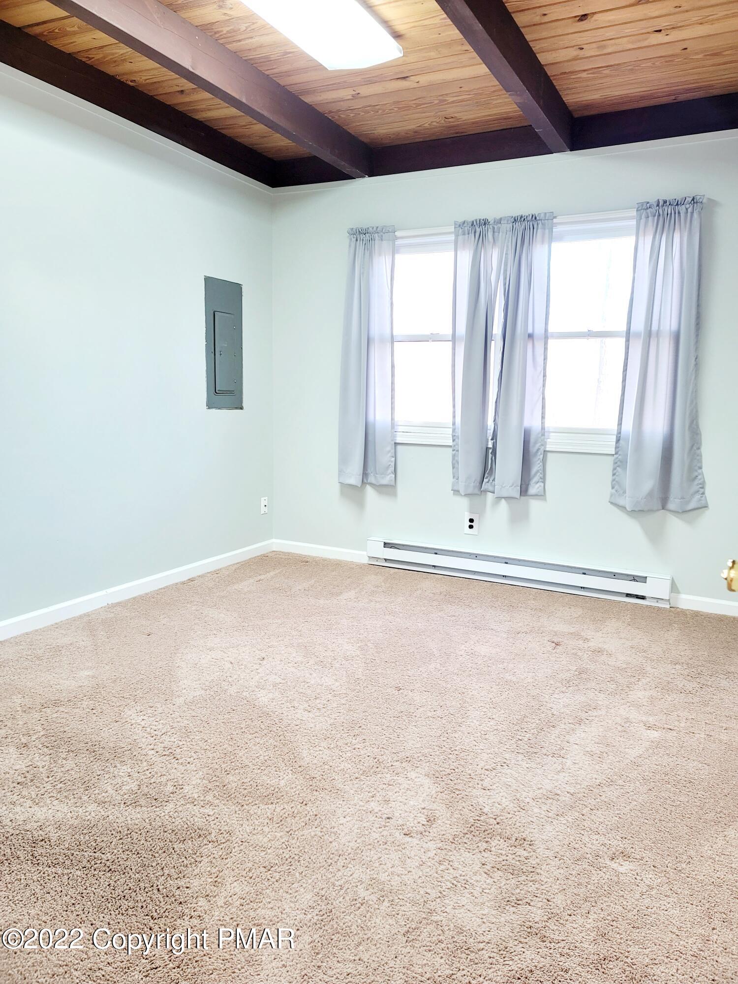 132 Rodeo Drive Hawley, PA 18428 - Photo 9 of 26 a view of an empty room with a window