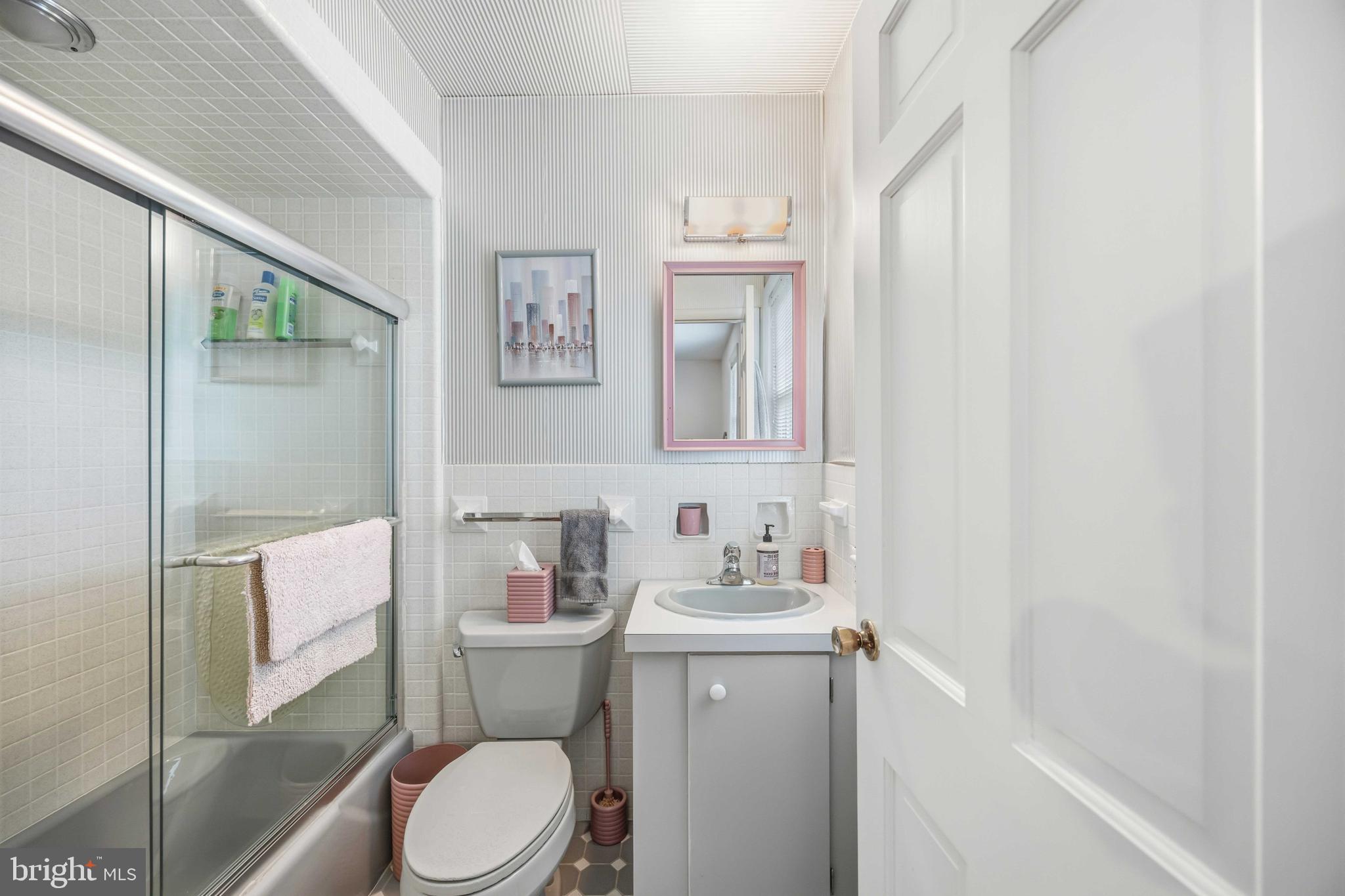 330 Bent Road Wyncote, PA 19095 - Photo 35 of 47 a bathroom with a sink a toilet and shower curtain
