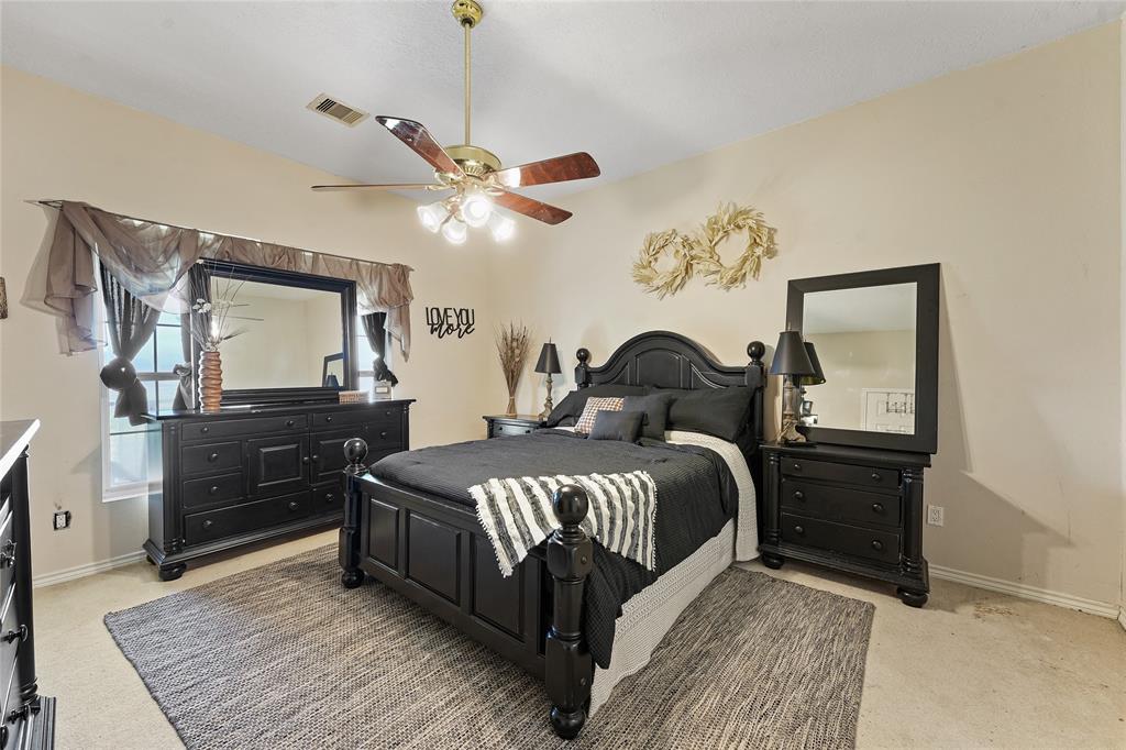 8515 Sandy Hill Road Brenham, TX 77833 - Photo 21 of 25 Bedroom featuring light colored carpet and ceiling fan