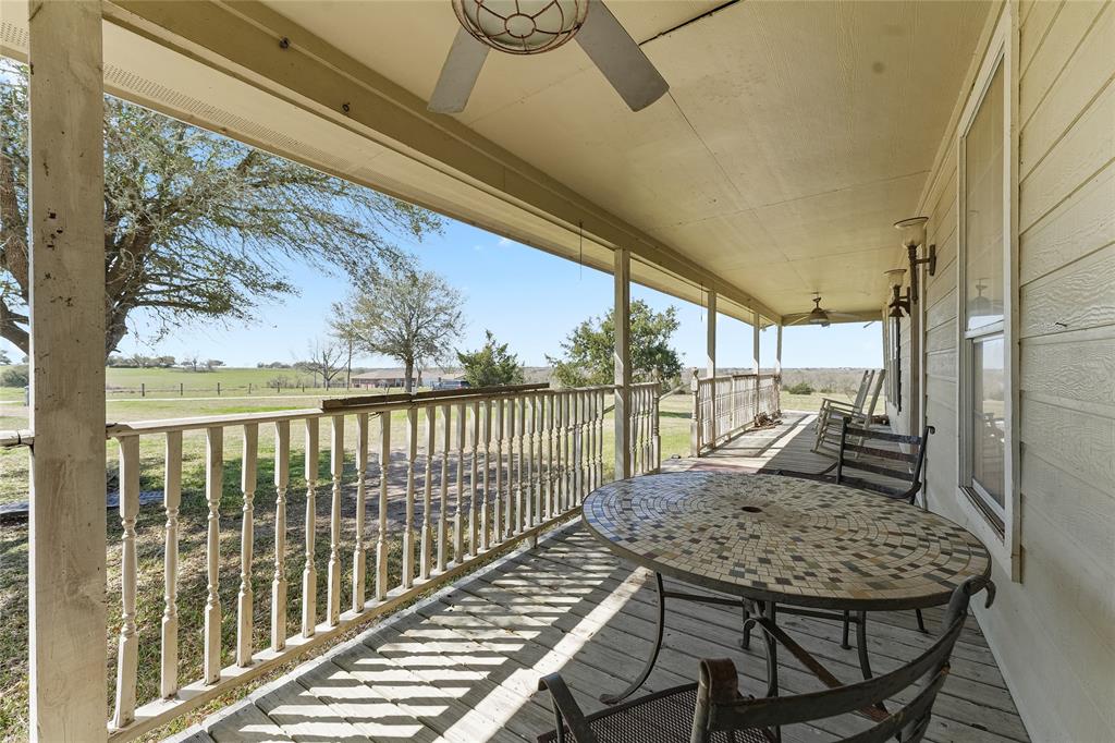 8515 Sandy Hill Road Brenham, TX 77833 - Photo 24 of 25 Balcony featuring a ceiling fan and a view of countryside