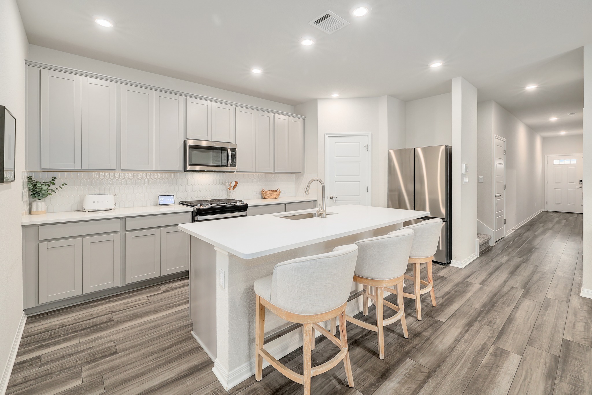 144 Sungrove Trail Georgetown, TX 78628 - Photo 7 of 40 The kitchen offers stainless steel appliances with an upgraded gas range