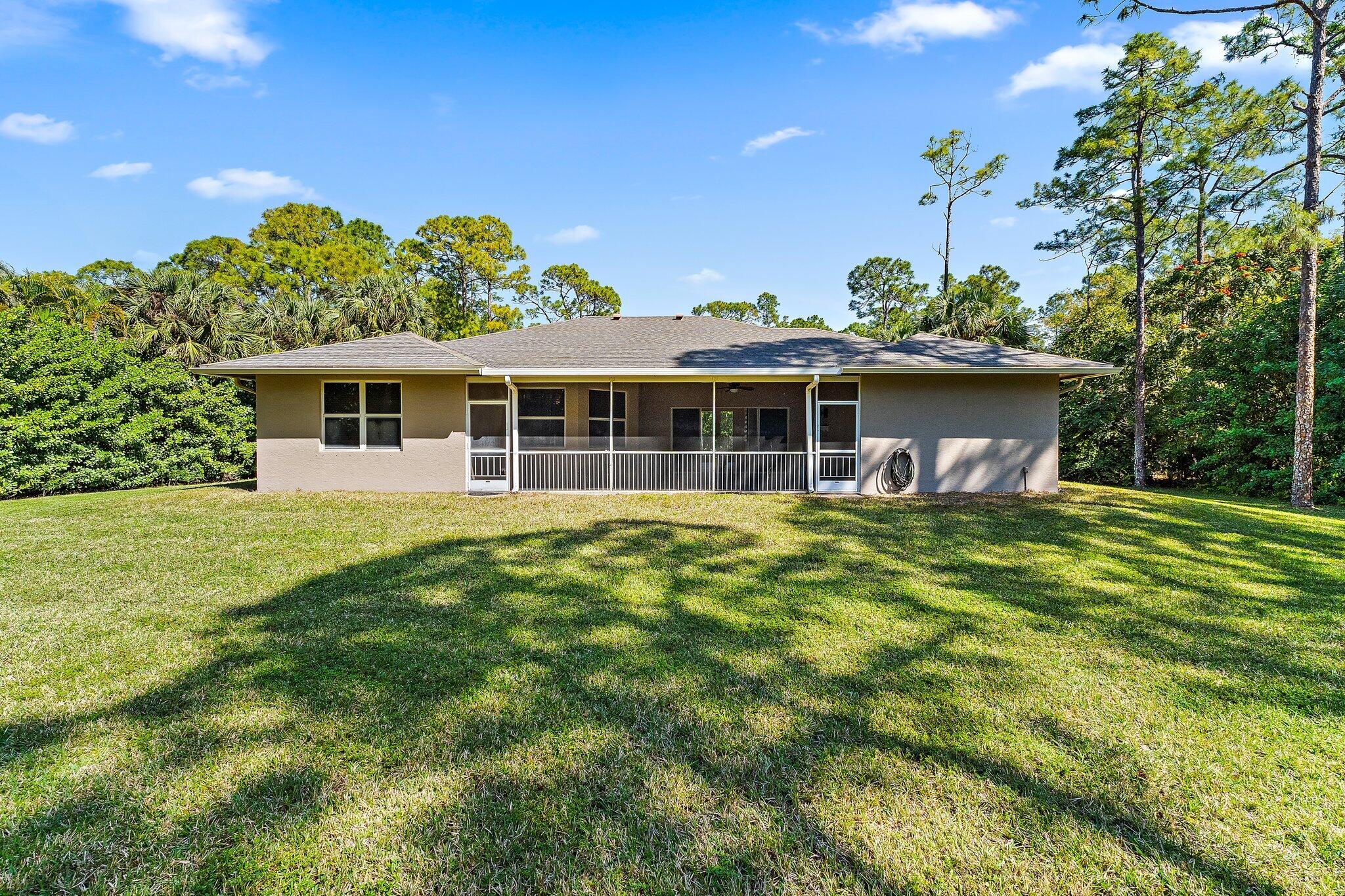 9608 Mockingbird Trail Jupiter, FL 33478 - Photo 39 of 48 Back exterior