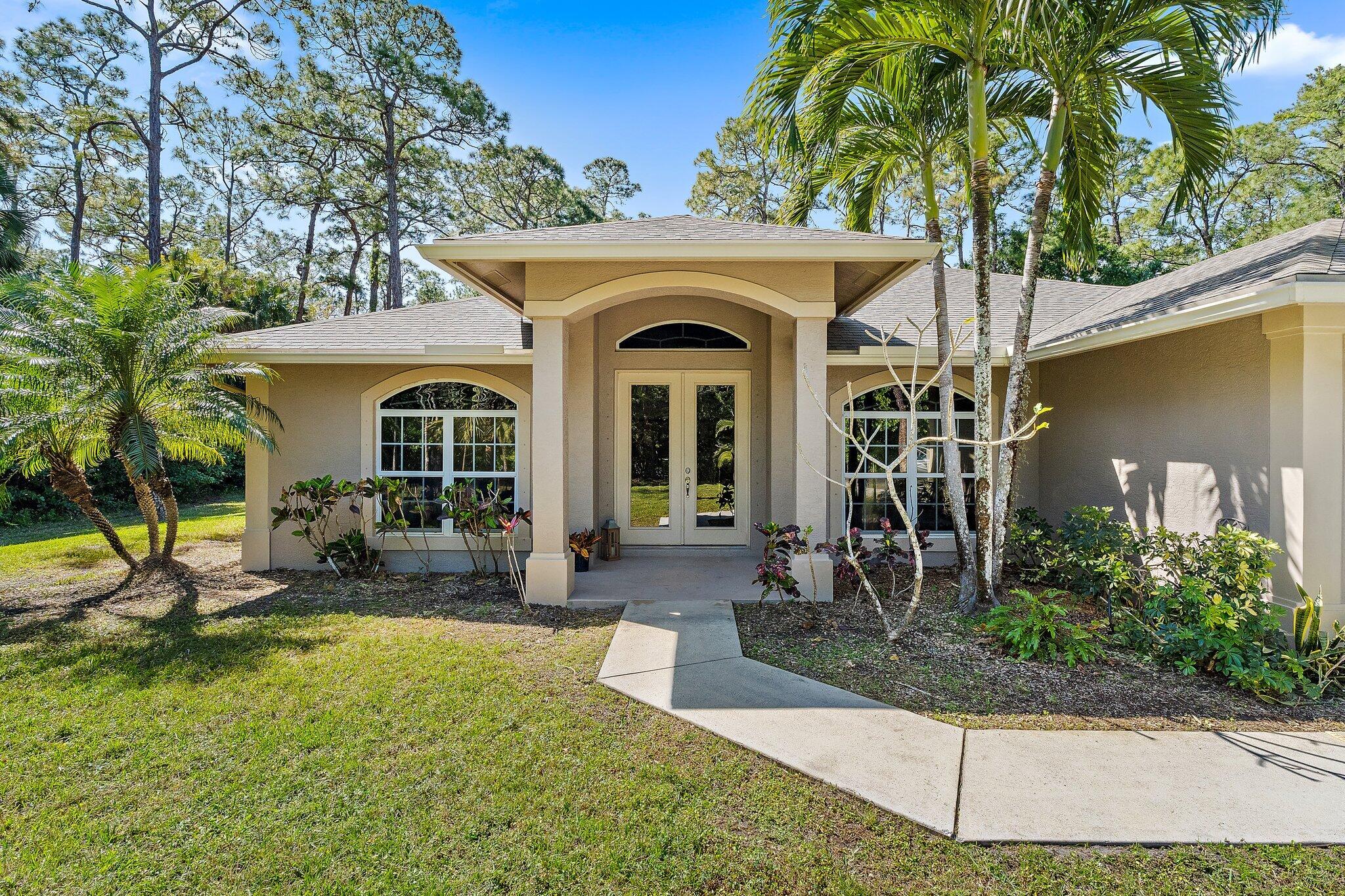 9608 Mockingbird Trail Jupiter, FL 33478 - Photo 9 of 48 Curb appeal