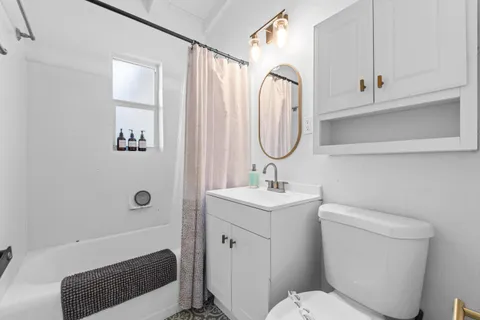 a bathroom with a toilet a sink and a bathtub