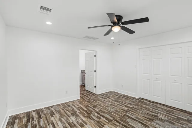a view of an empty walk in closet
