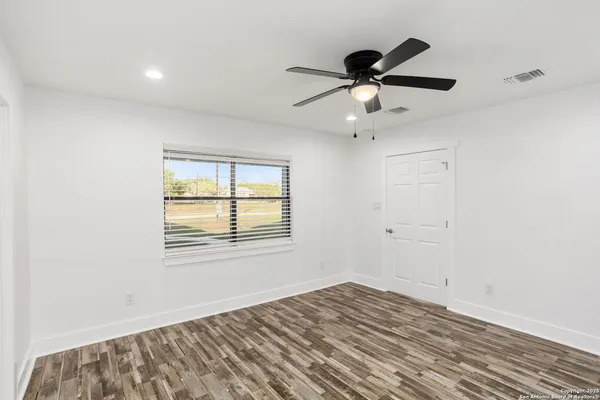 a bathroom with a shower and a sink