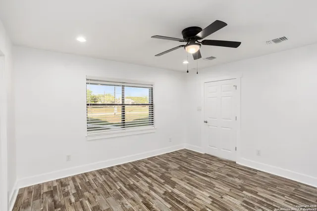 a bathroom with a shower and a sink