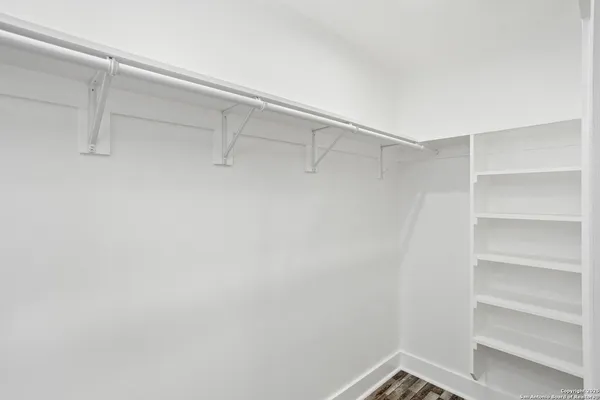 a utility room with granite countertop cabinets washer and dryer