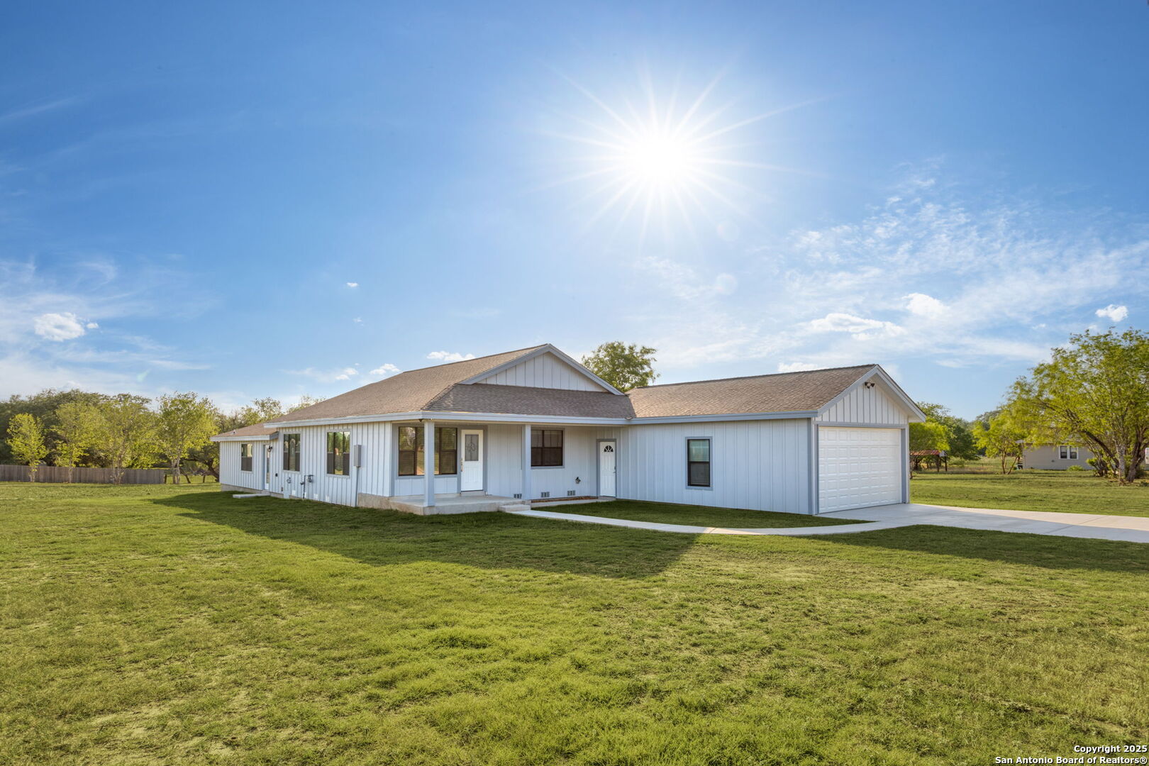 310 Creek Lane Poth, TX 78147 - Photo 2 of 32 a house with swimming pool in front of it