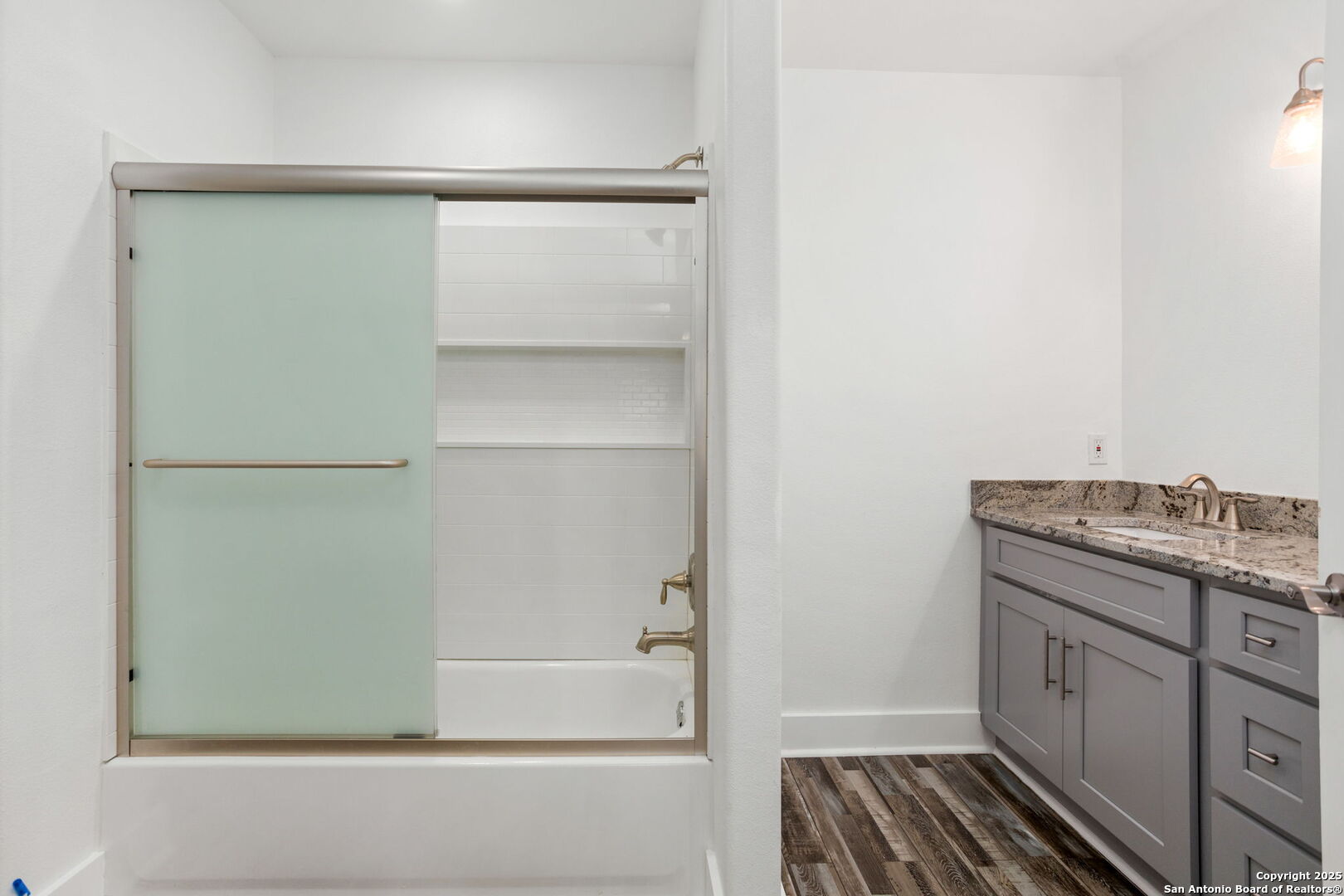 310 Creek Lane Poth, TX 78147 - Photo 21 of 32 a bathroom with a shower and a sink