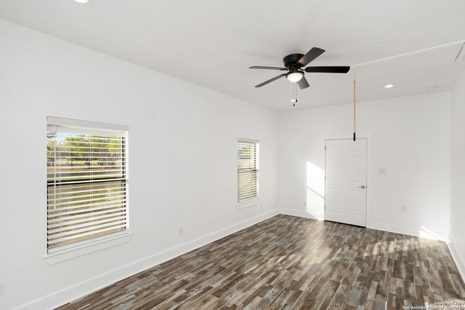 310 Creek Lane Poth, TX 78147 - Photo 32 of 32 a view of empty room with wooden floor and fan
