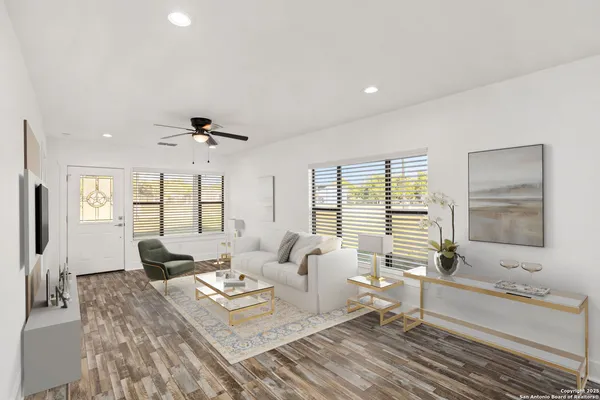a kitchen with a dining table chairs and view living room