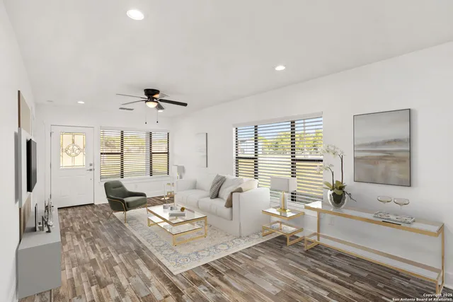 a kitchen with a dining table chairs and view living room