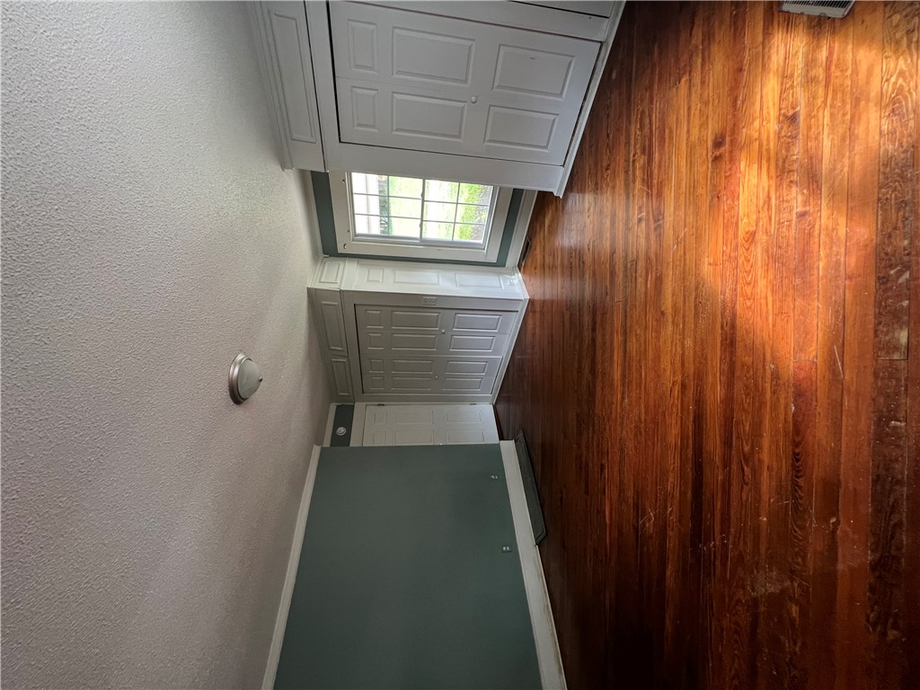 309 Jaynes Street Walhalla, SC 29691 - Photo 6 of 12 Rich hardwood flooring extends from the entryway, creating a warm and inviting atmosphere.