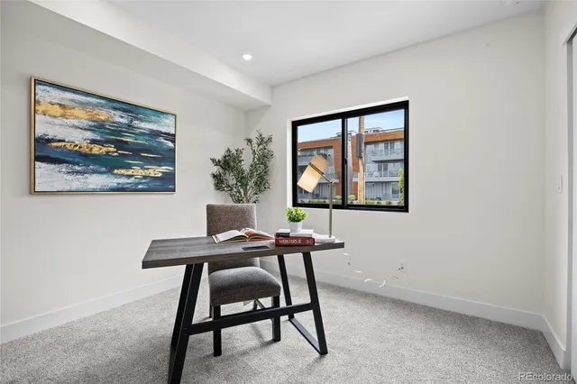 a workspace with furniture and window