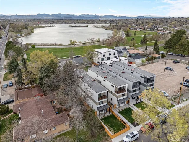 an aerial view of residential building and lake view
