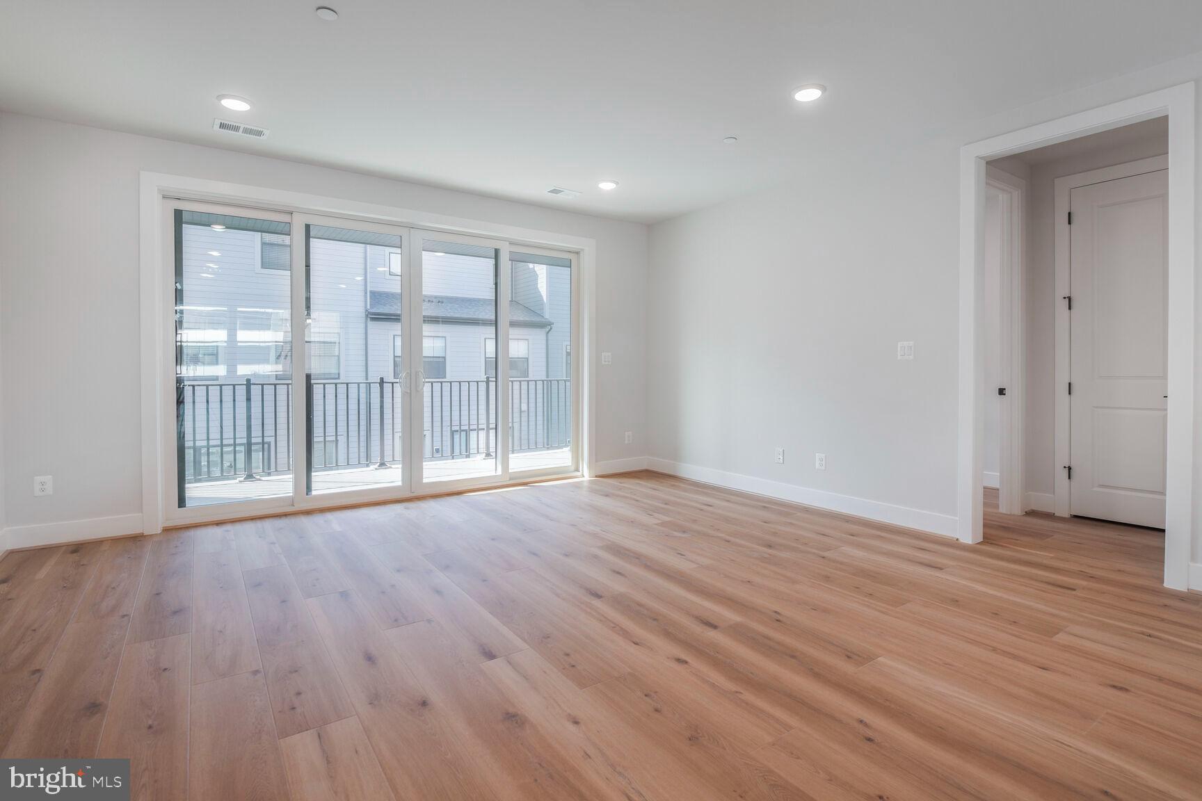 6020 Montrose Road North Bethesda, MD 20852 - Photo 15 of 27 wooden floor in an empty room with a window
