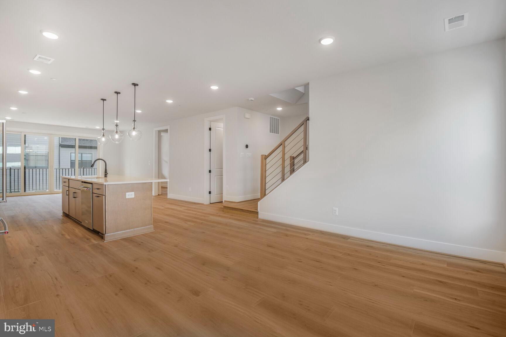 6020 Montrose Road North Bethesda, MD 20852 - Photo 18 of 27 a view of a big room with wooden floor and windows