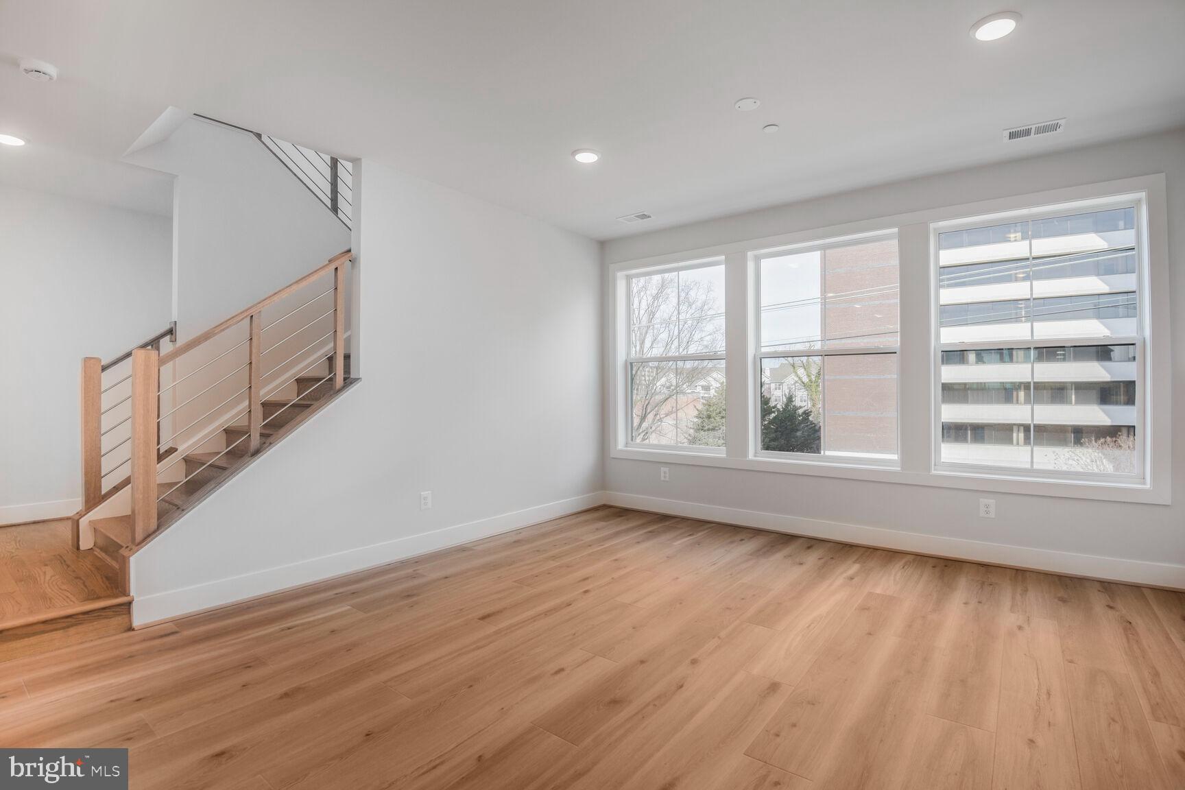 6020 Montrose Road North Bethesda, MD 20852 - Photo 19 of 27 a view of room with window and wooden floor
