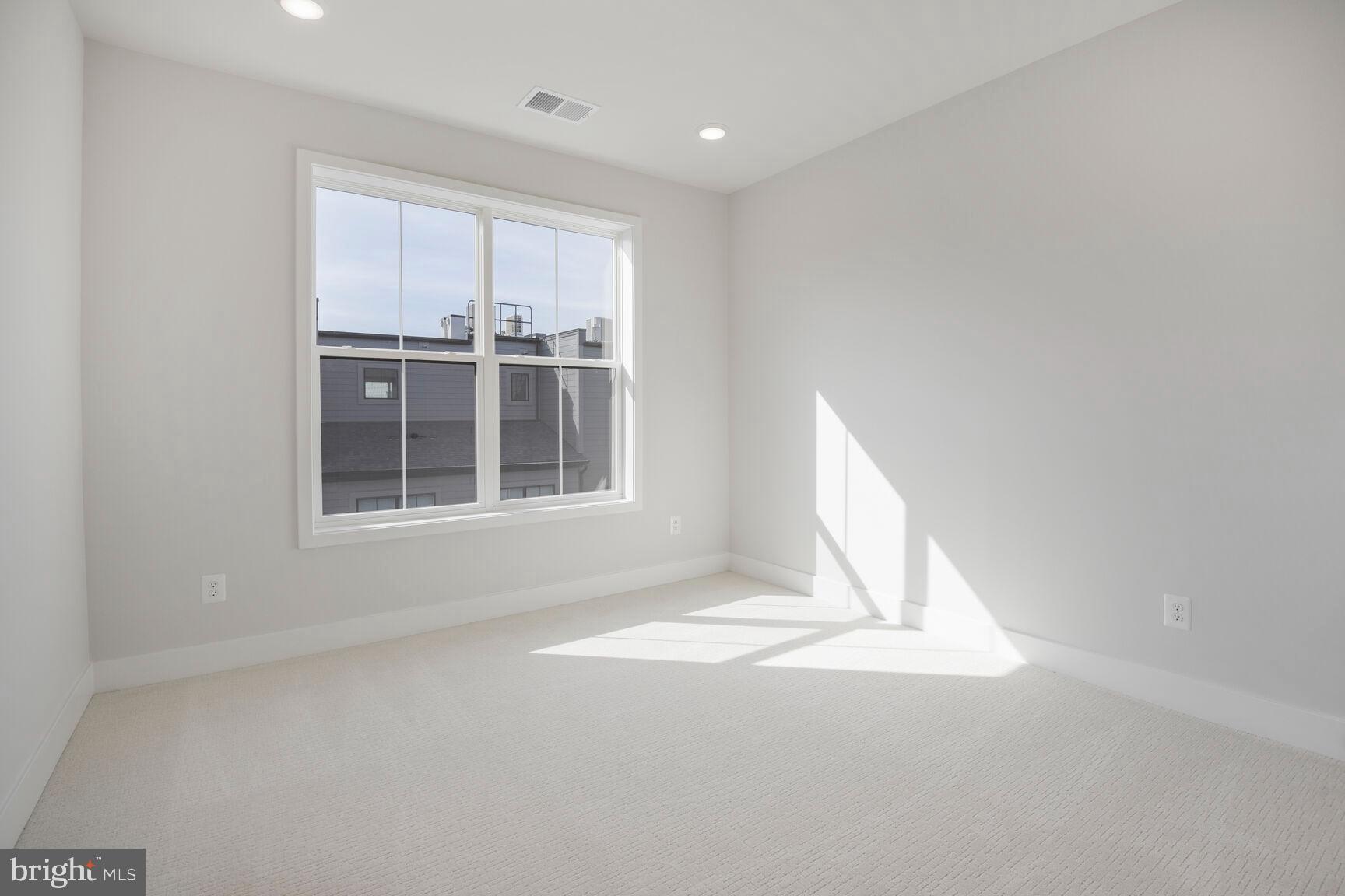 6020 Montrose Road North Bethesda, MD 20852 - Photo 21 of 27 a view of empty room with wooden floor and fan