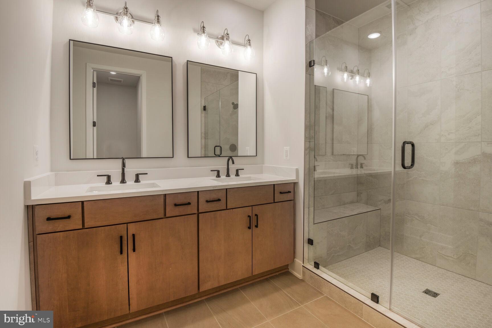 6020 Montrose Road North Bethesda, MD 20852 - Photo 24 of 27 a bathroom with double sink and a mirror