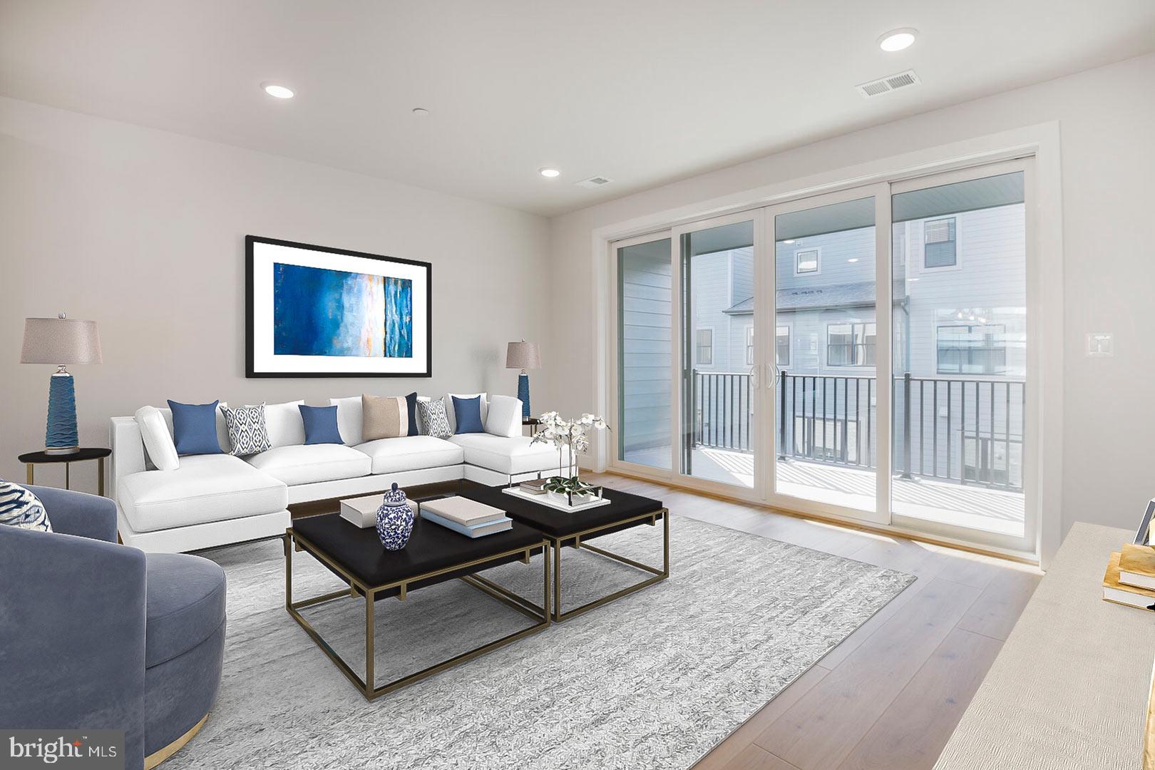 6020 Montrose Road North Bethesda, MD 20852 - Photo 4 of 27 a living room with furniture and a floor to ceiling window