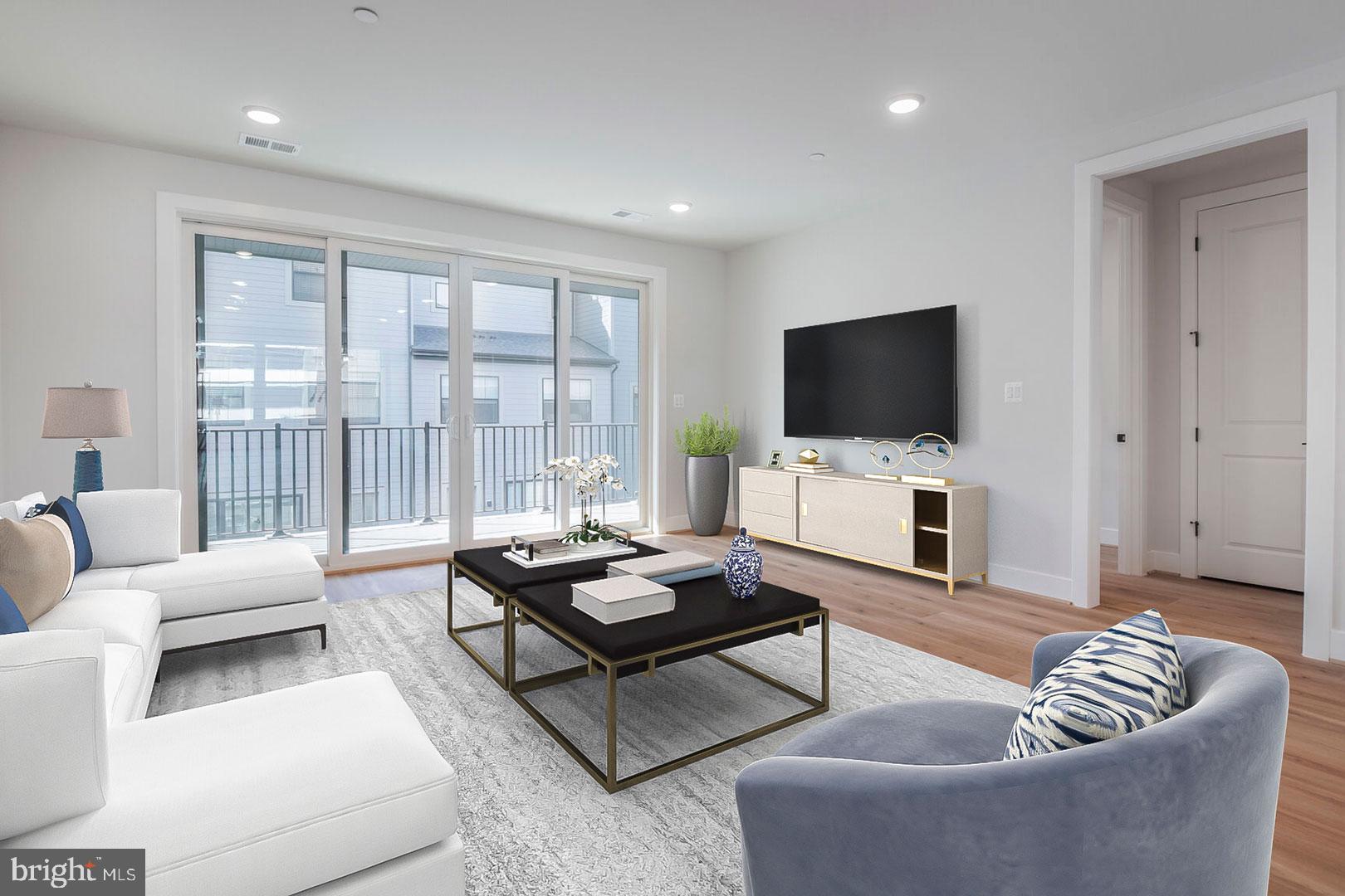 6020 Montrose Road North Bethesda, MD 20852 - Photo 5 of 27 a living room with furniture and a flat screen tv