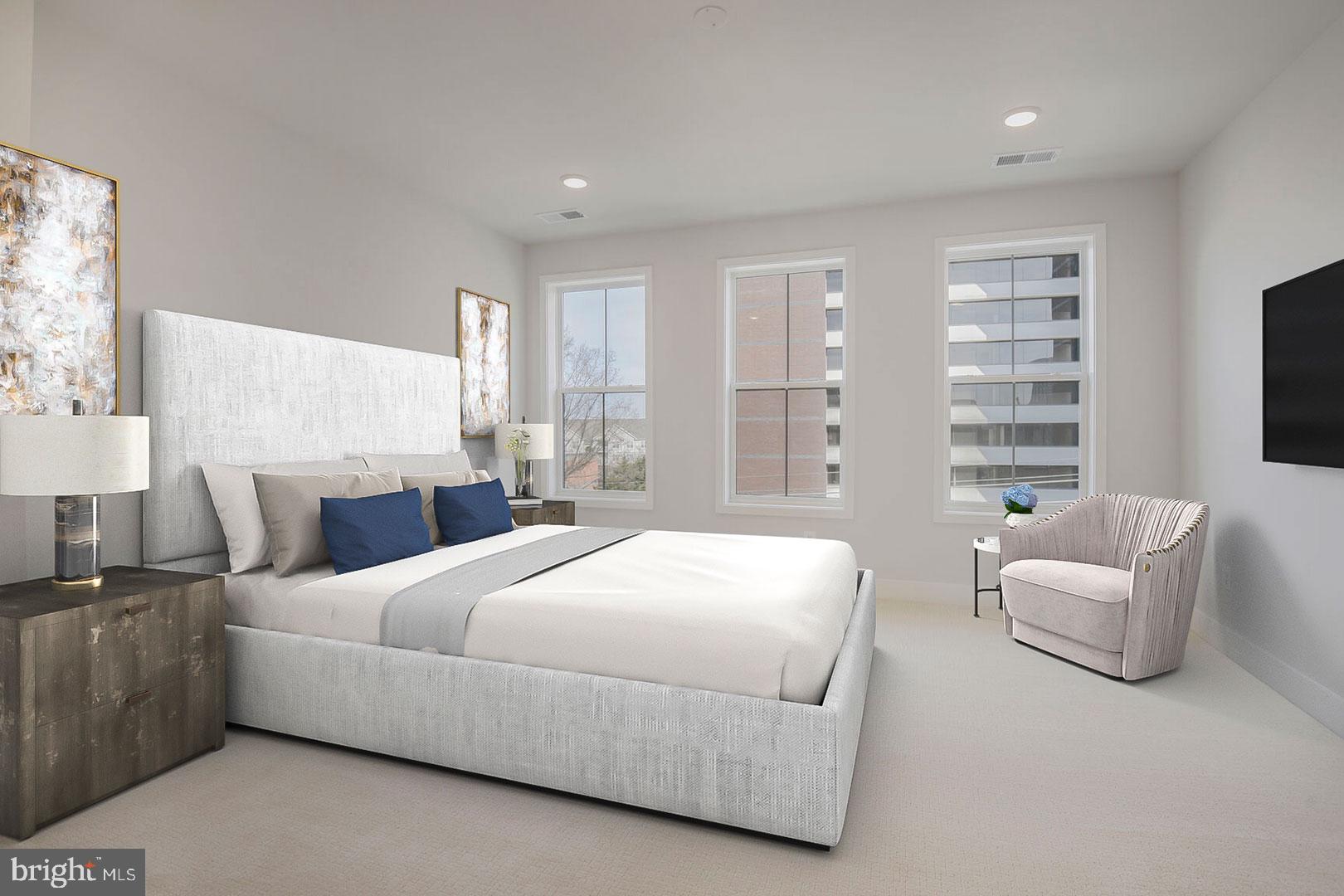 6020 Montrose Road North Bethesda, MD 20852 - Photo 7 of 27 a bedroom with a bed and a couch