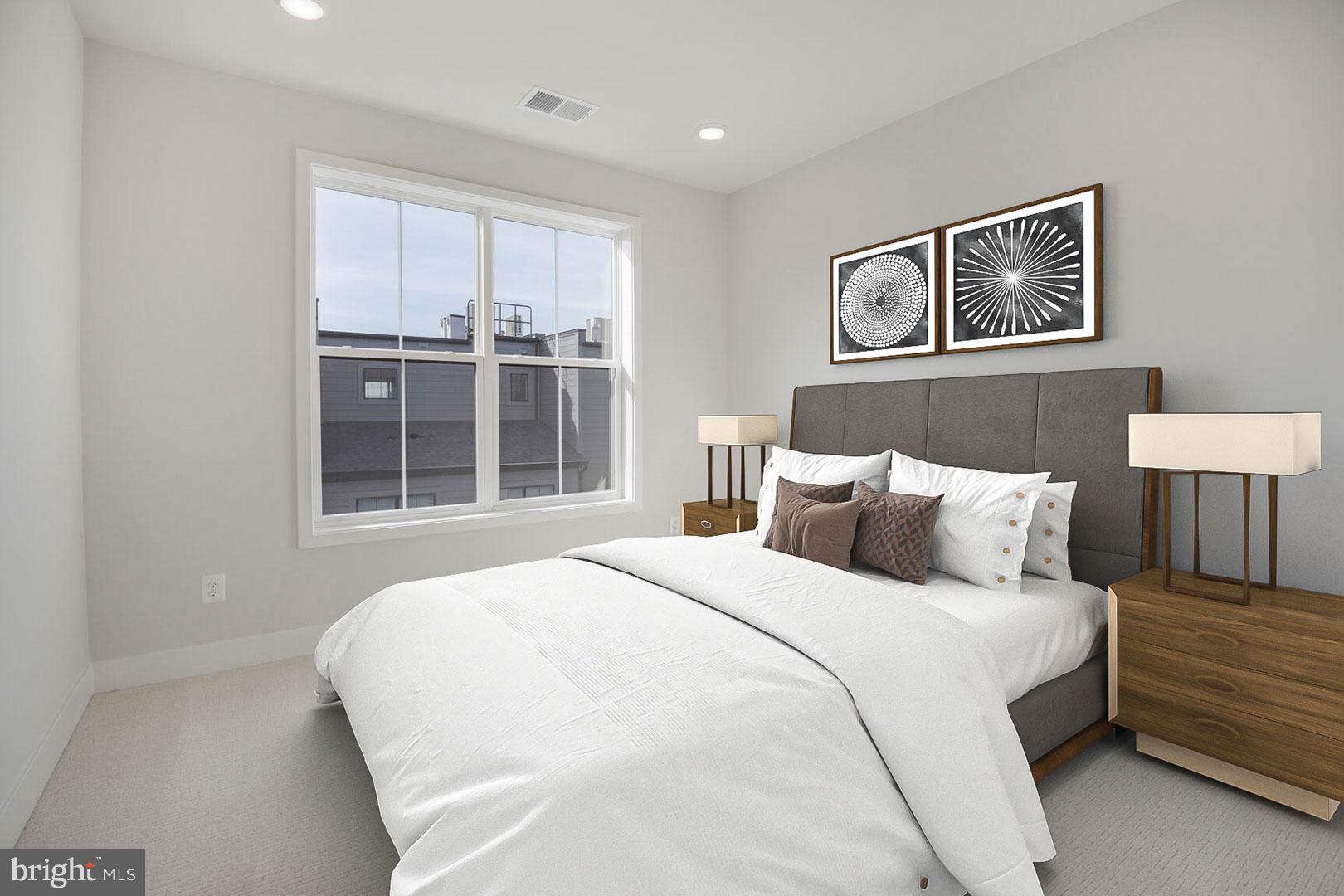 6020 Montrose Road North Bethesda, MD 20852 - Photo 9 of 27 a large bed sitting in a bedroom next to a window