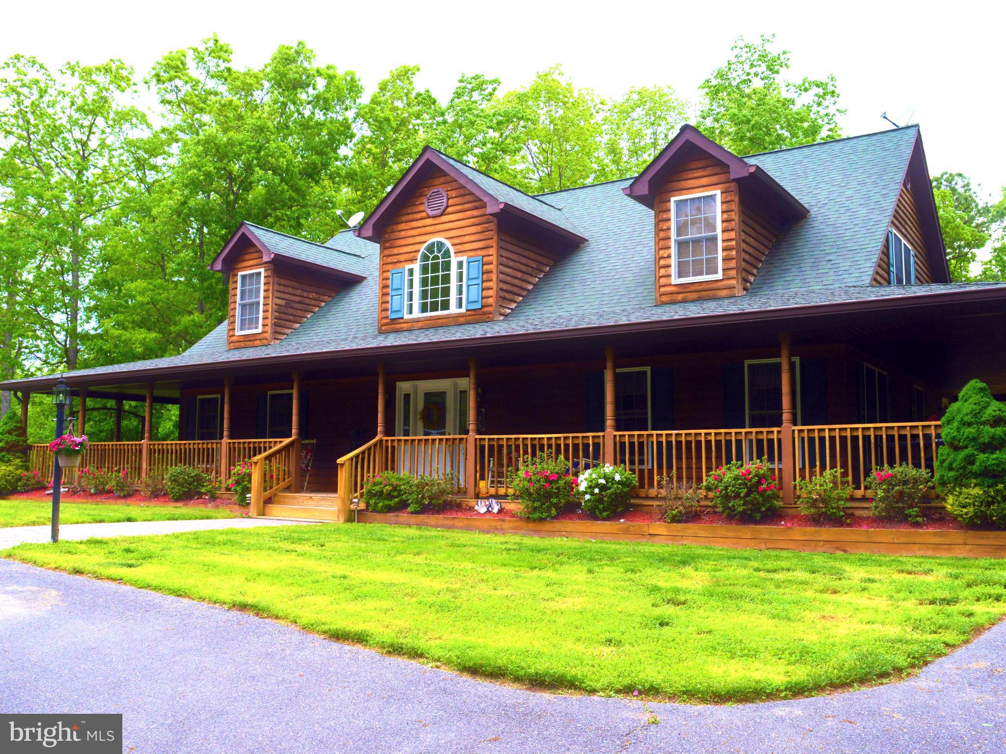 495 McCubbin Road Winchester, VA 22603 - Photo 1 of 29 a front view of a house with a yard and fence