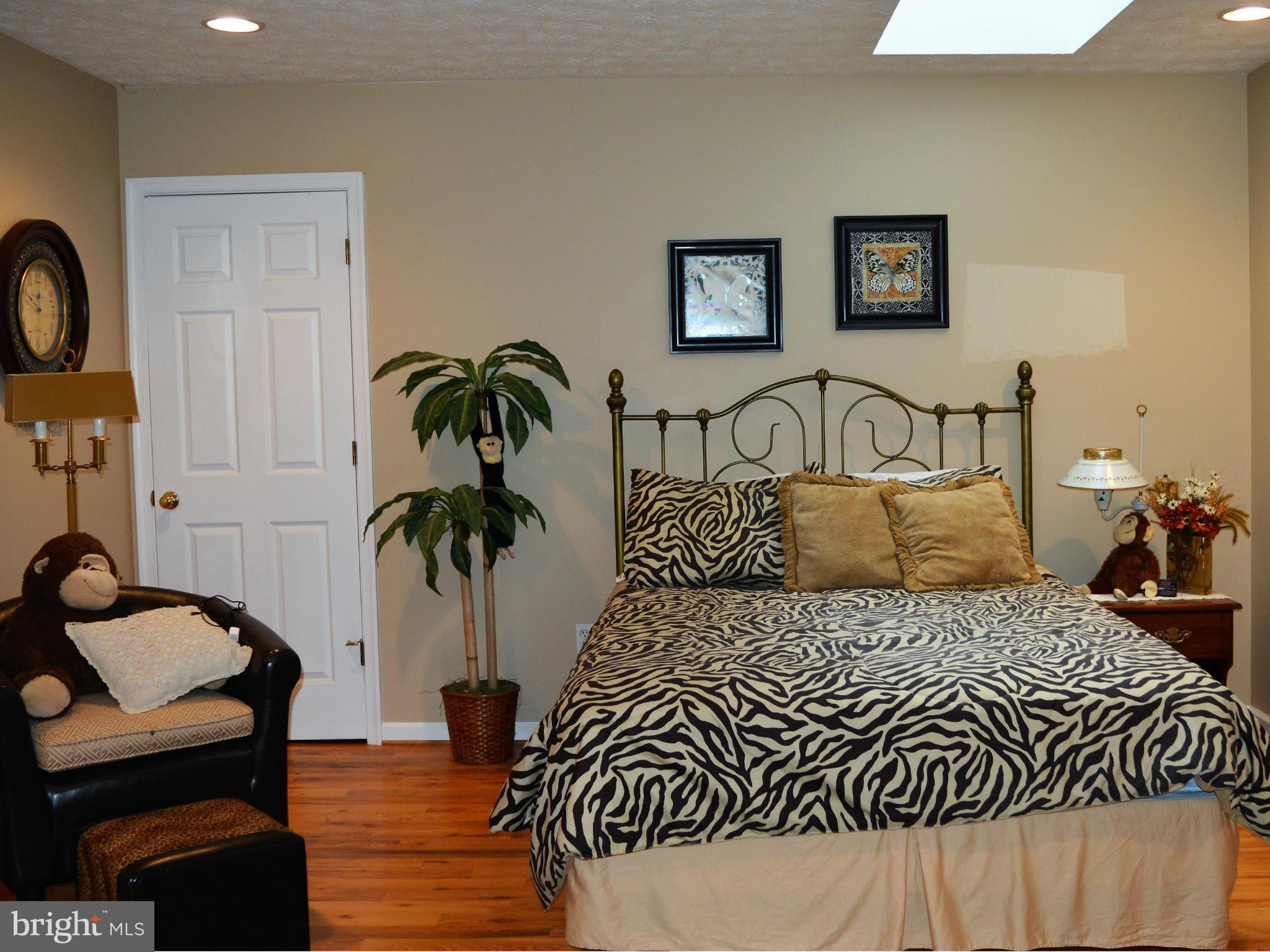 495 McCubbin Road Winchester, VA 22603 - Photo 16 of 29 a bedroom with a bed and a table in it