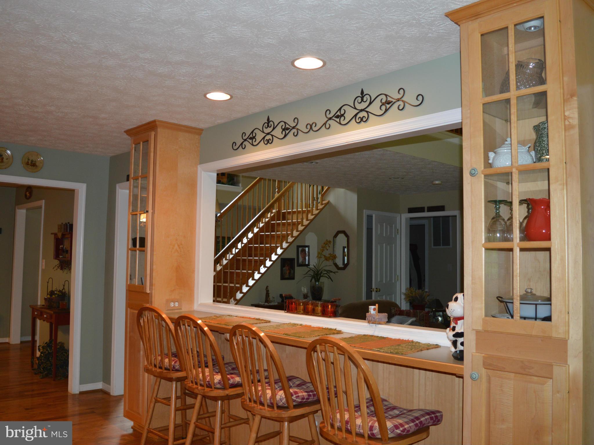 495 McCubbin Road Winchester, VA 22603 - Photo 3 of 29 a bed room with a bed and a large mirror