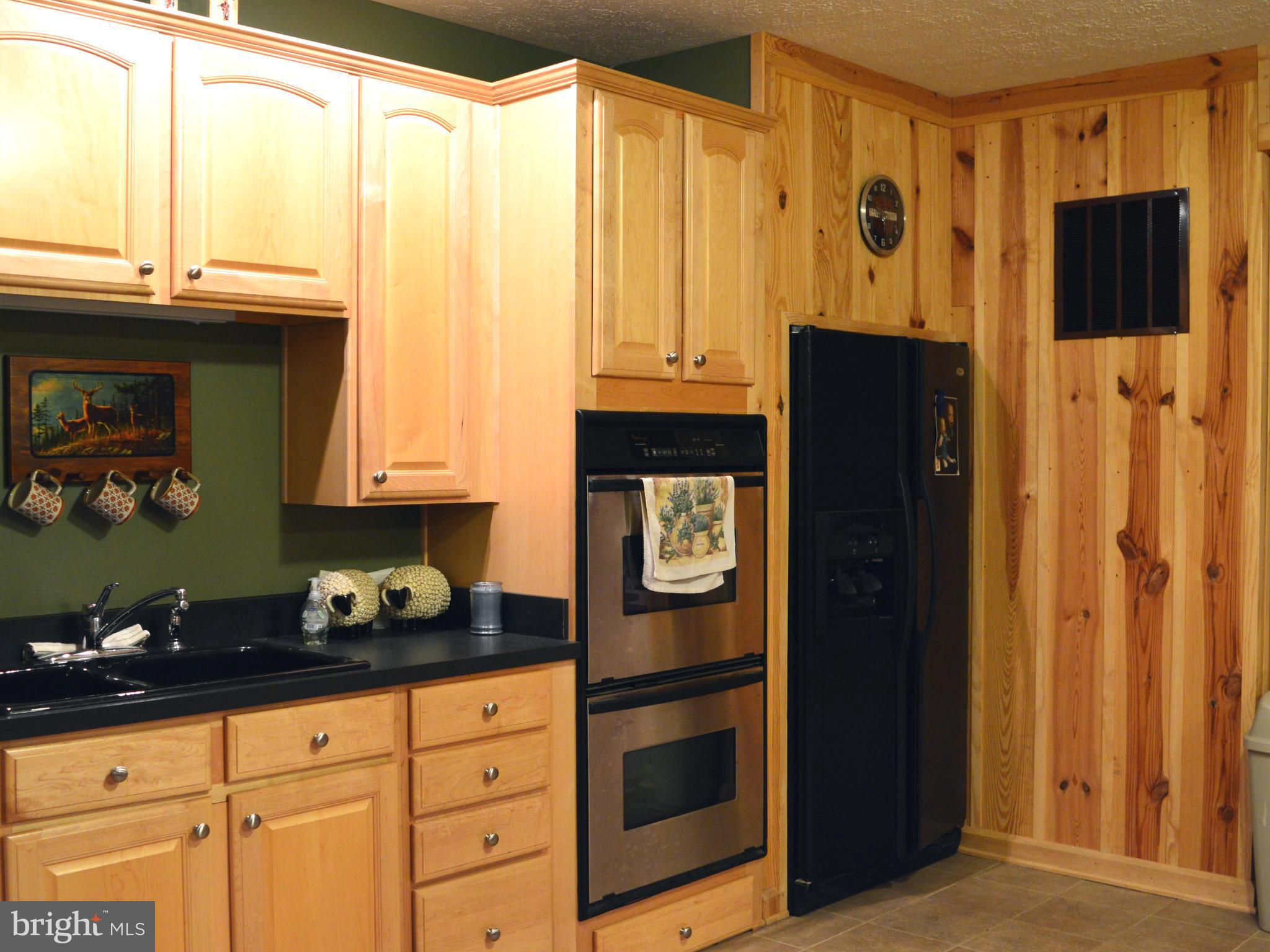 495 McCubbin Road Winchester, VA 22603 - Photo 21 of 29 a kitchen with stainless steel appliances granite countertop a refrigerator and a stove