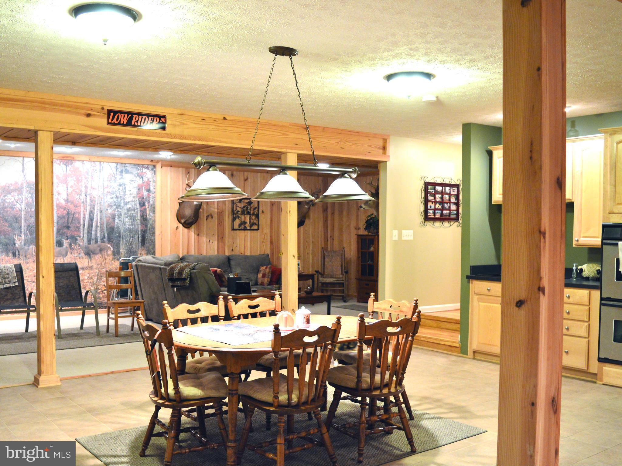 495 McCubbin Road Winchester, VA 22603 - Photo 24 of 29 a view of a dining room with furniture window and wooden floor