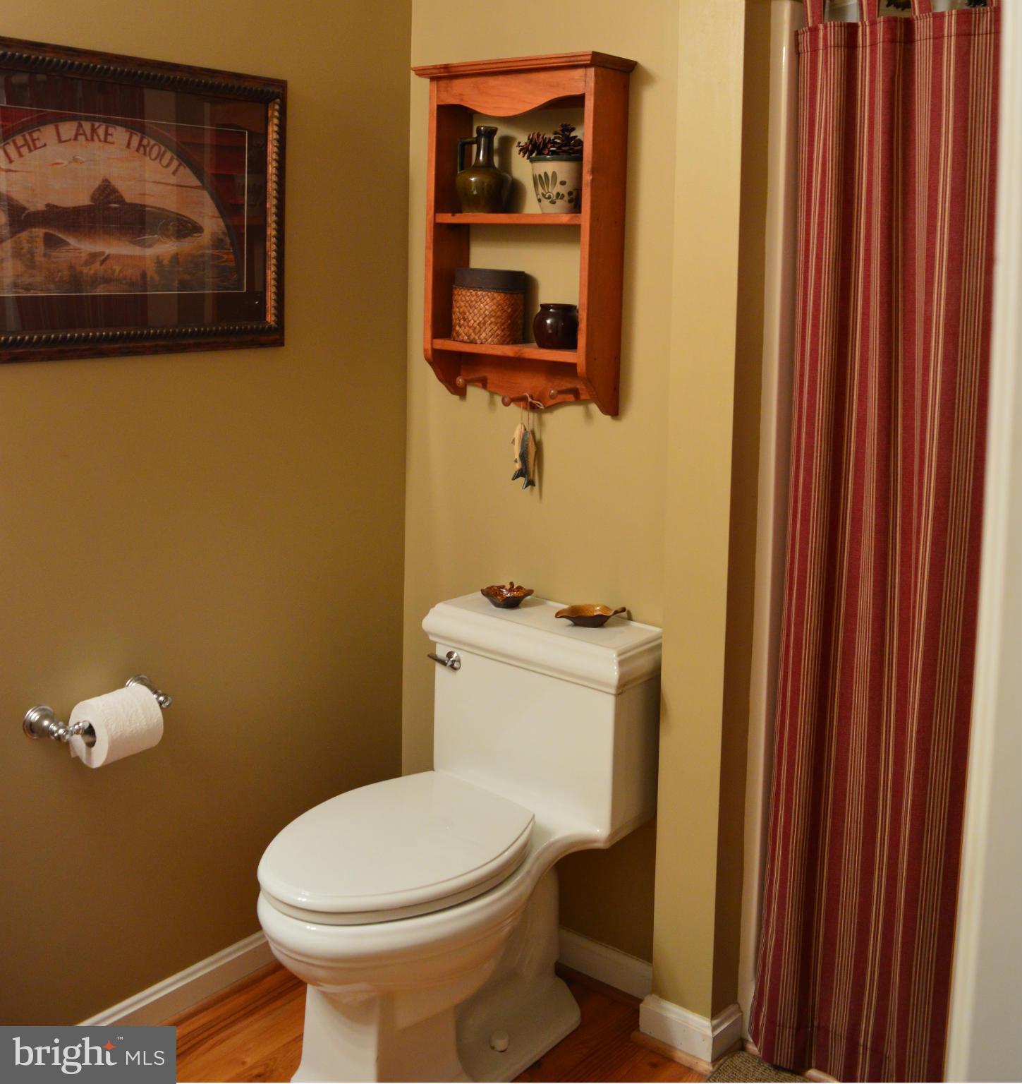 495 McCubbin Road Winchester, VA 22603 - Photo 25 of 29 a white toilet sitting next to a small bathroom