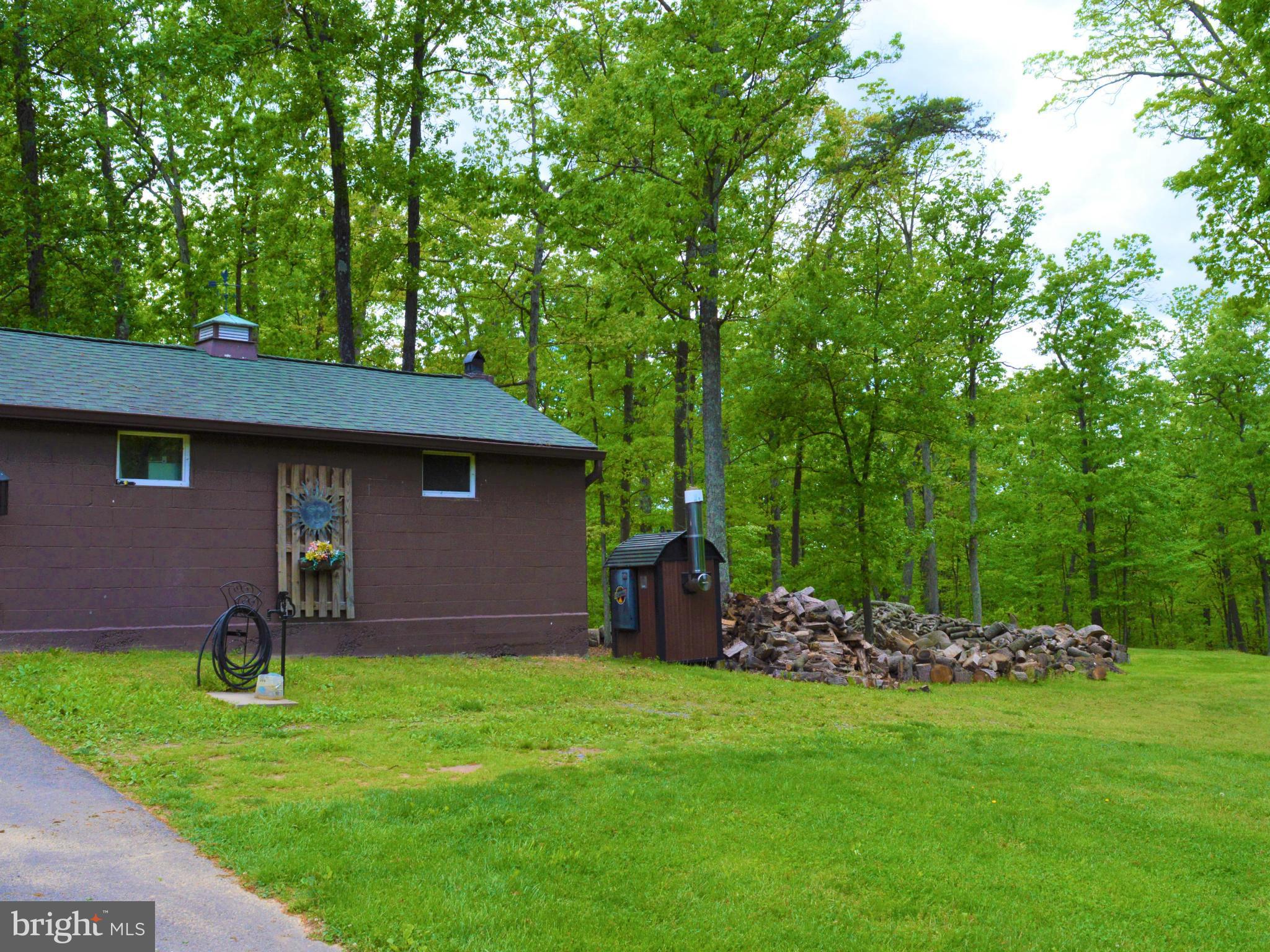 495 McCubbin Road Winchester, VA 22603 - Photo 29 of 29 a backyard of a house with table and chairs