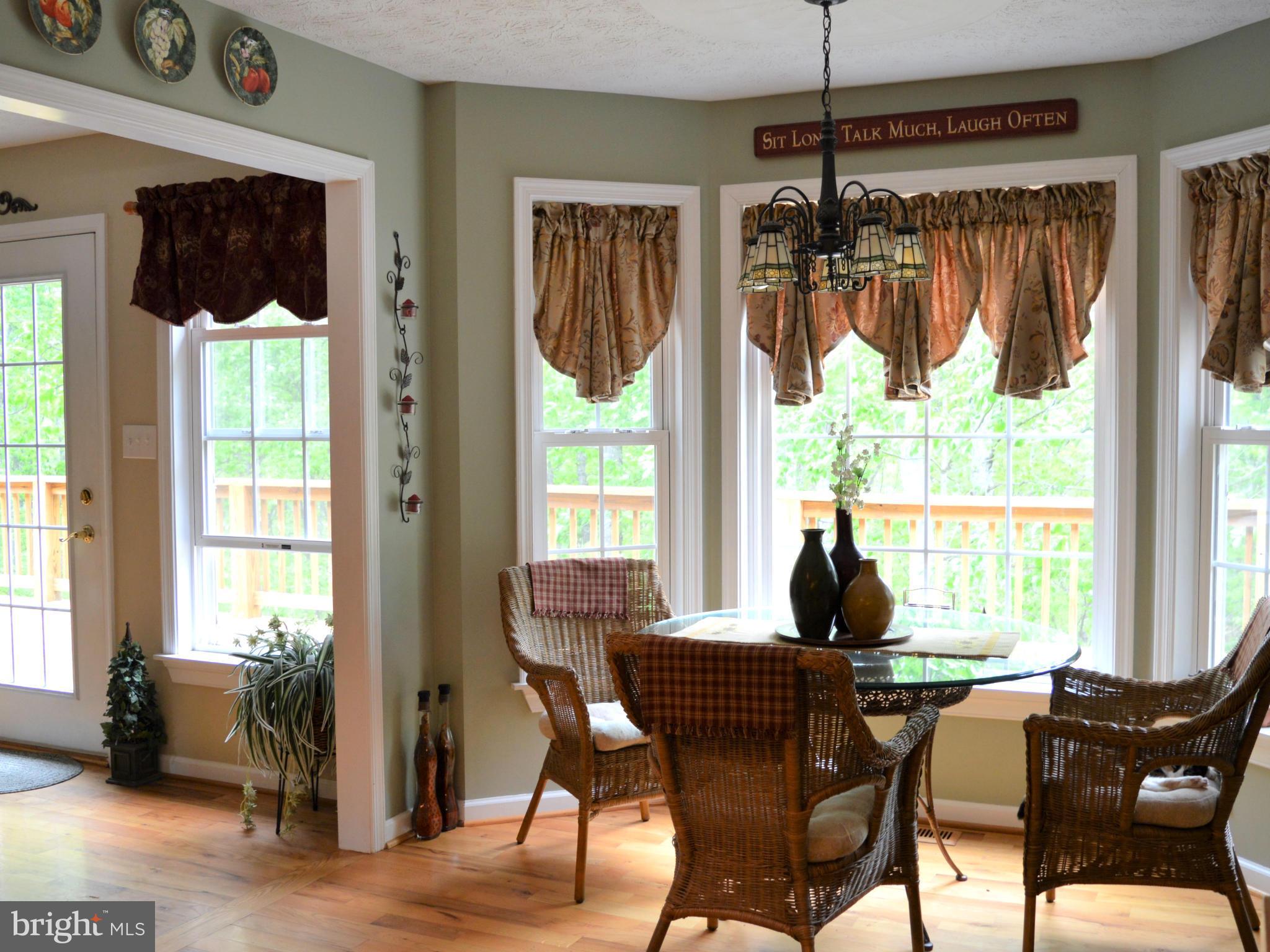 495 McCubbin Road Winchester, VA 22603 - Photo 4 of 29 a dining room with furniture window wooden floor
