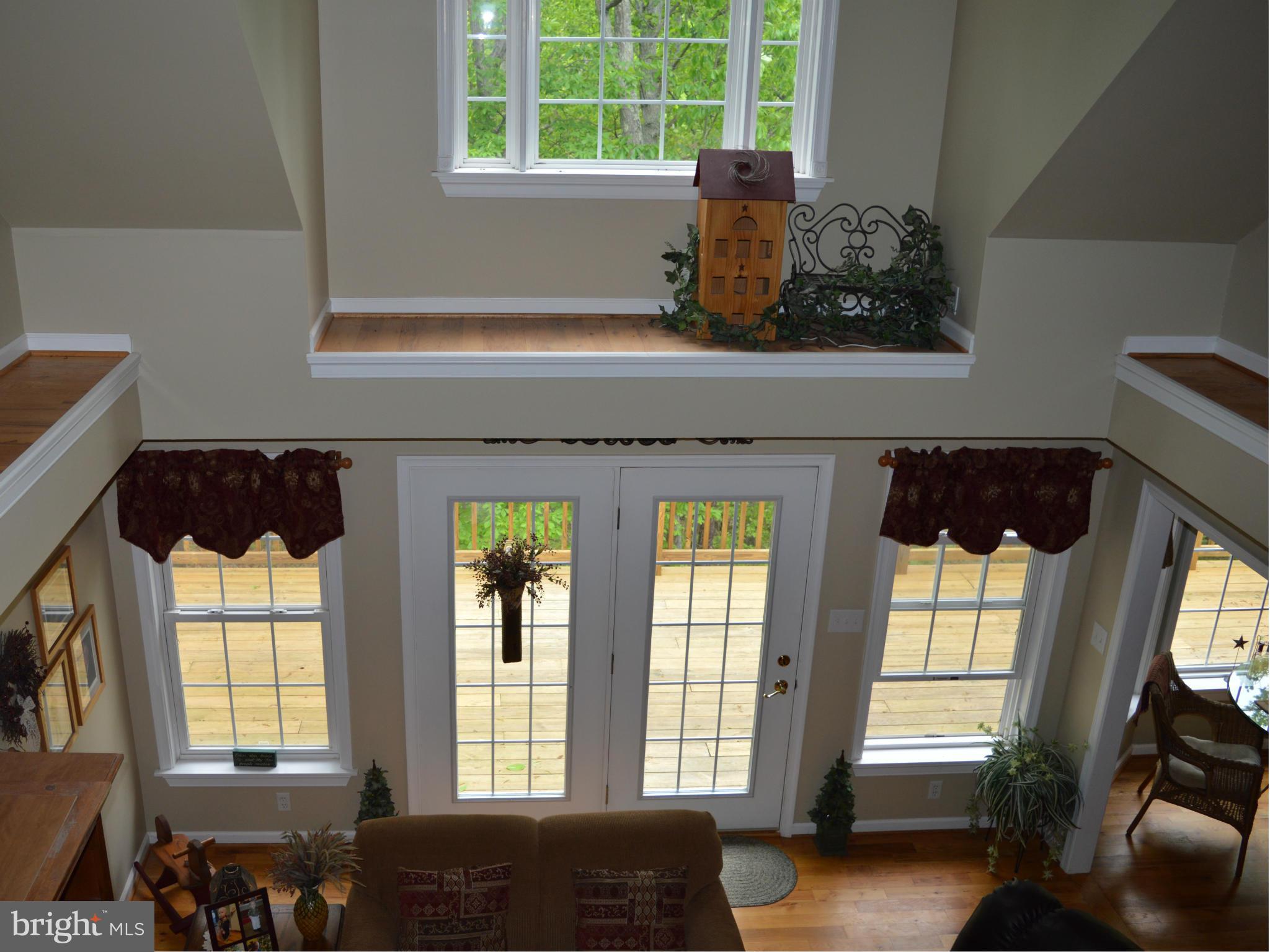 495 McCubbin Road Winchester, VA 22603 - Photo 6 of 29 a living room with furniture and a window