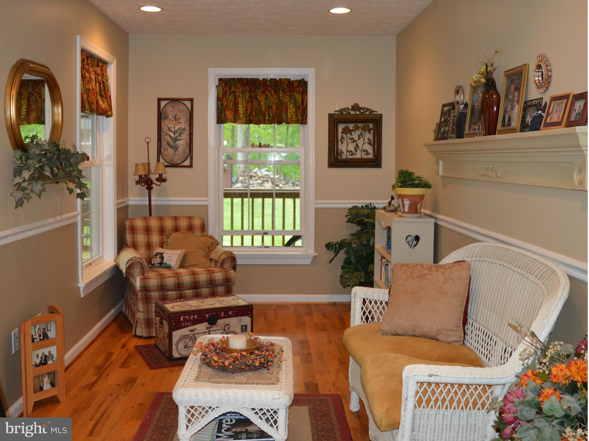 495 McCubbin Road Winchester, VA 22603 - Photo 8 of 29 a living room with furniture and a window